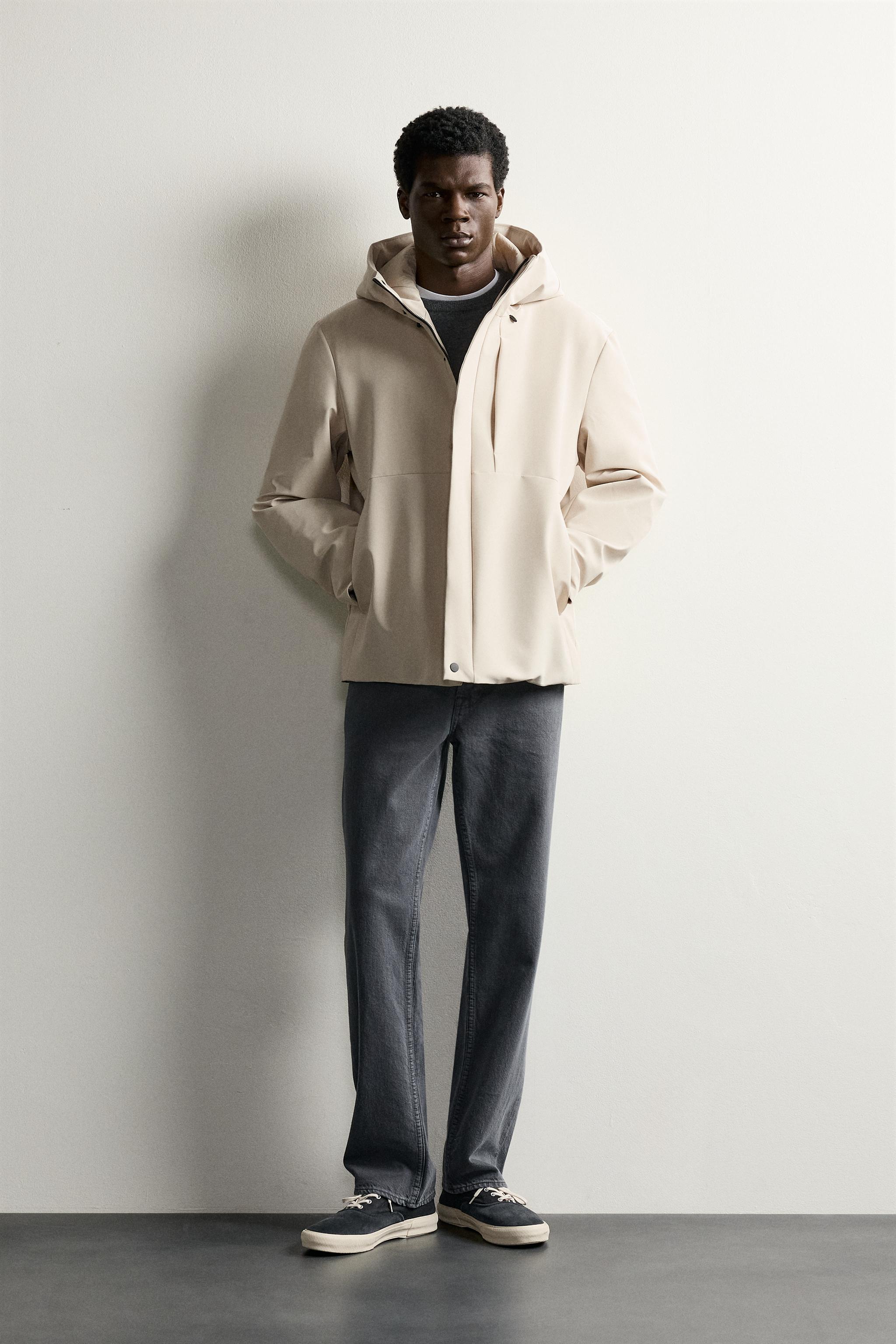 BLOUSON TECHNIQUE À CAPUCHE DÉPERLANT