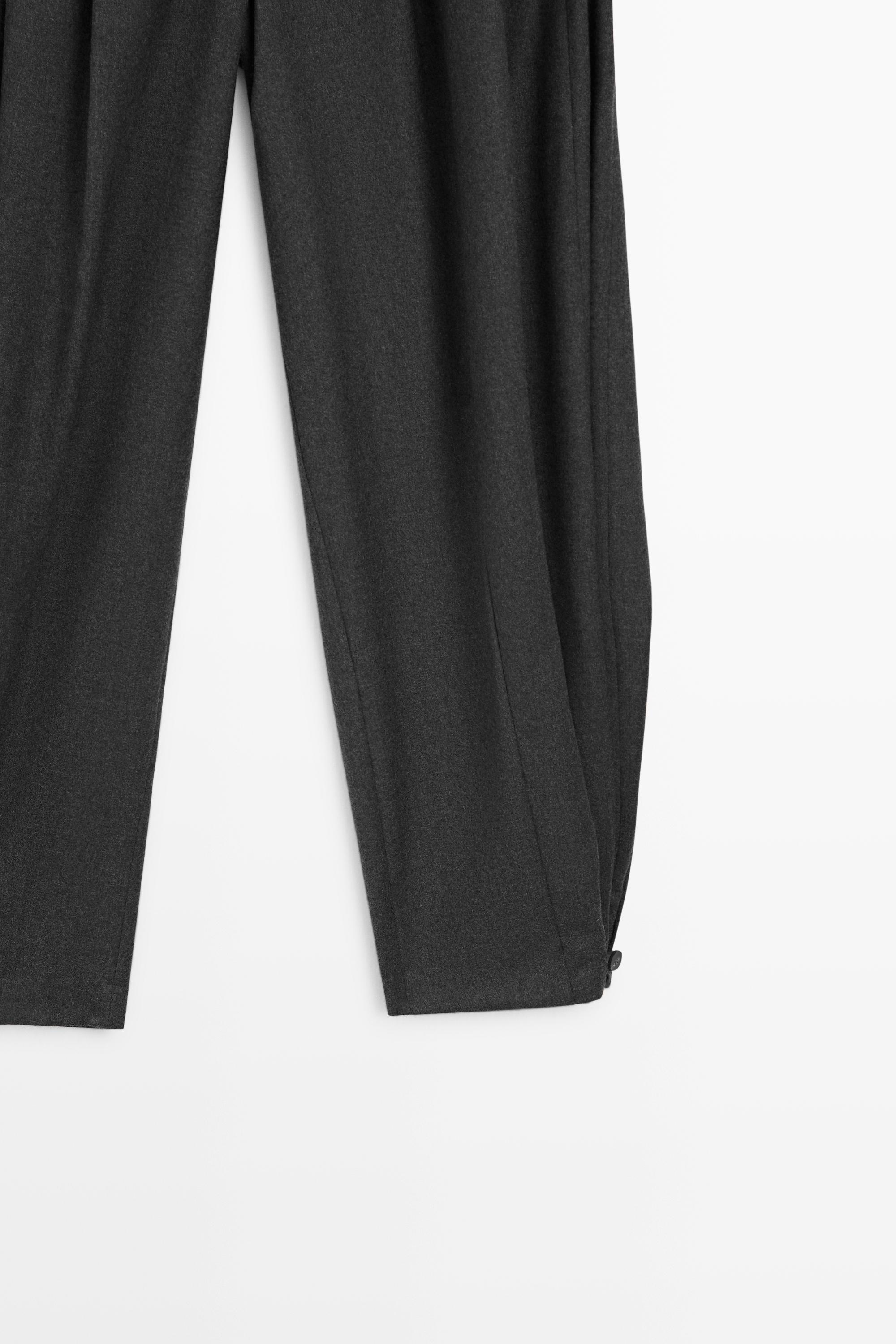 Pantalon flanelle à plis et détail bas
