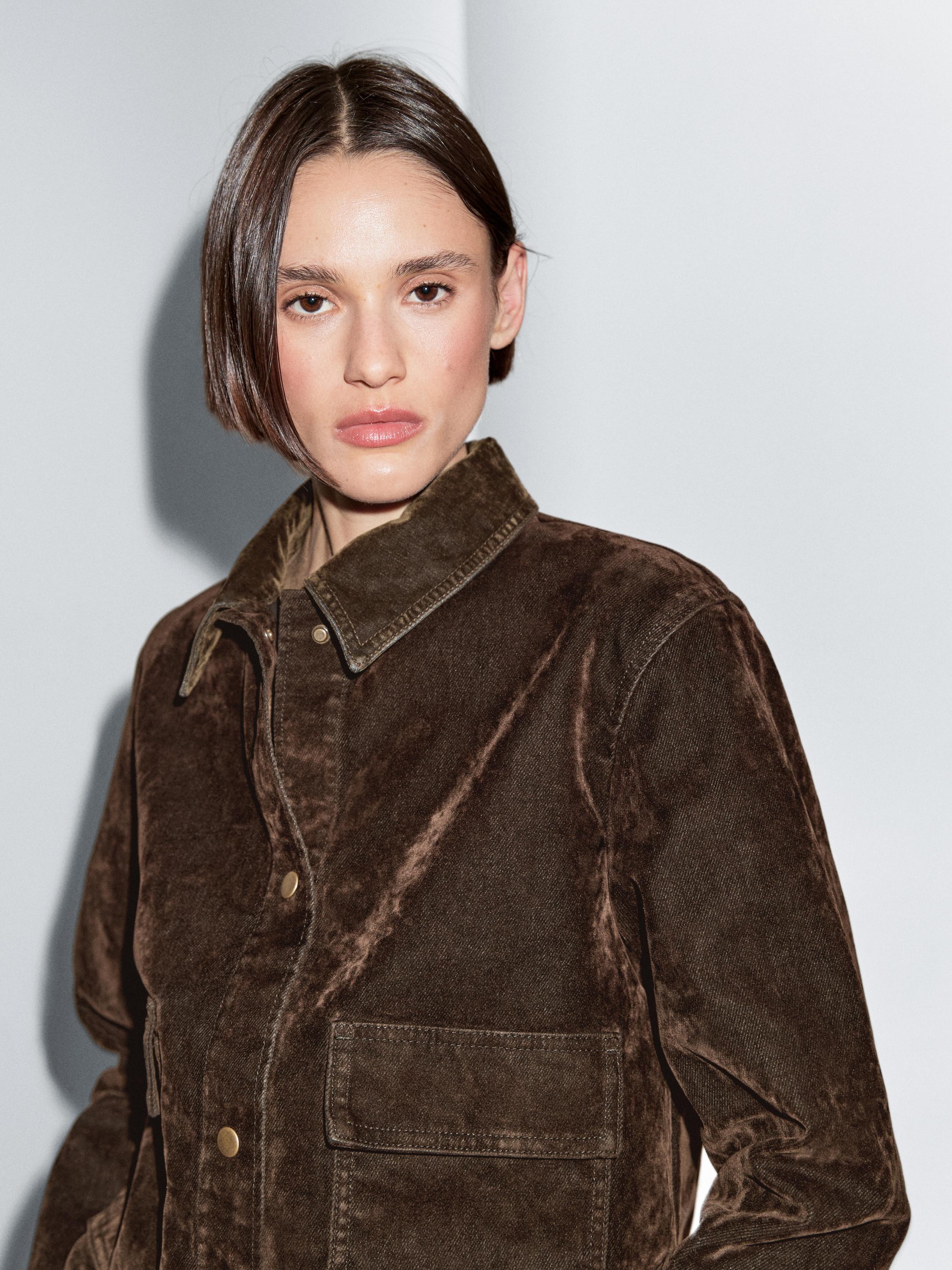 Short denim jacket with pockets and flocked finish