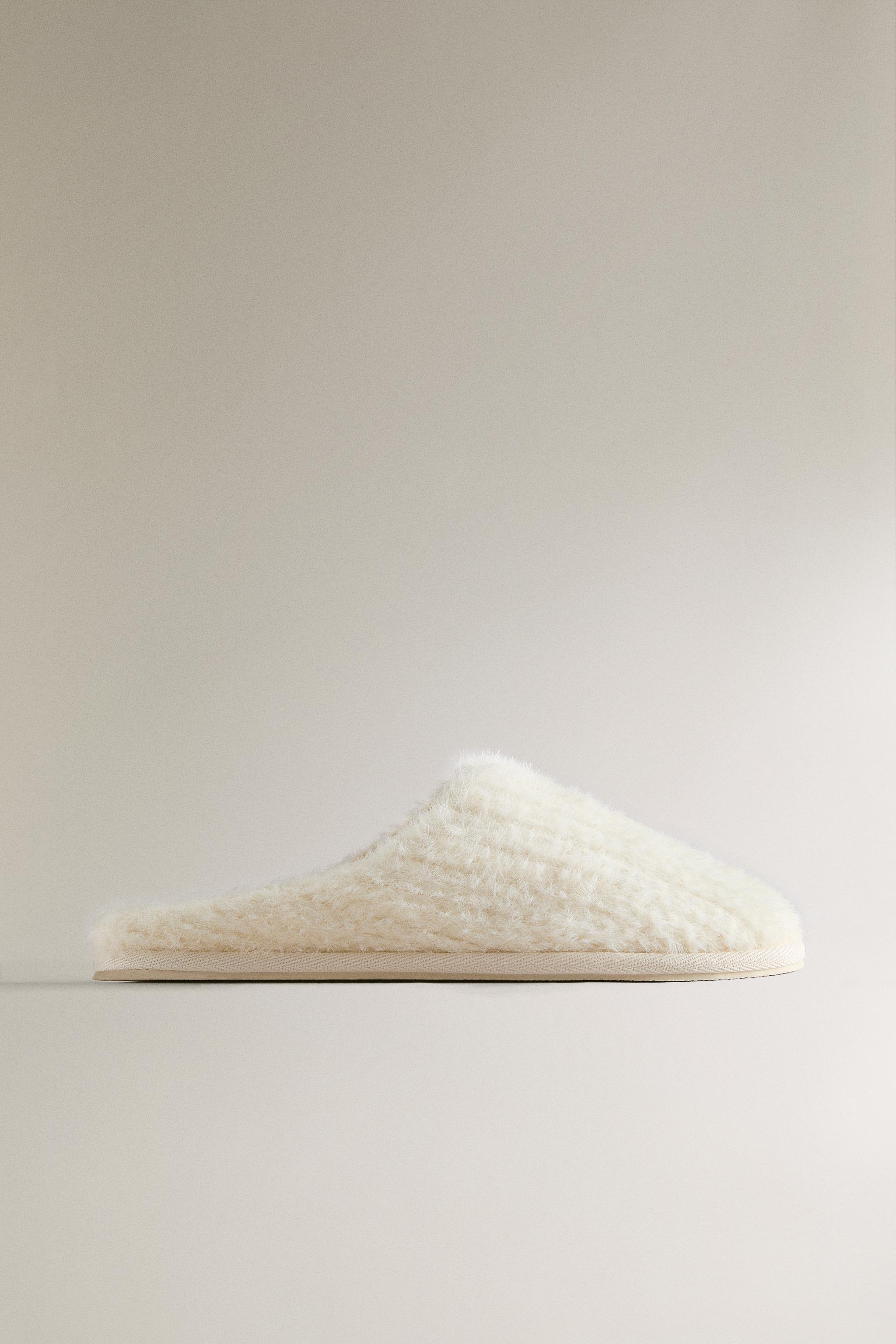 SLIPPERS WITH BRAIDED FAUX FUR DETAIL