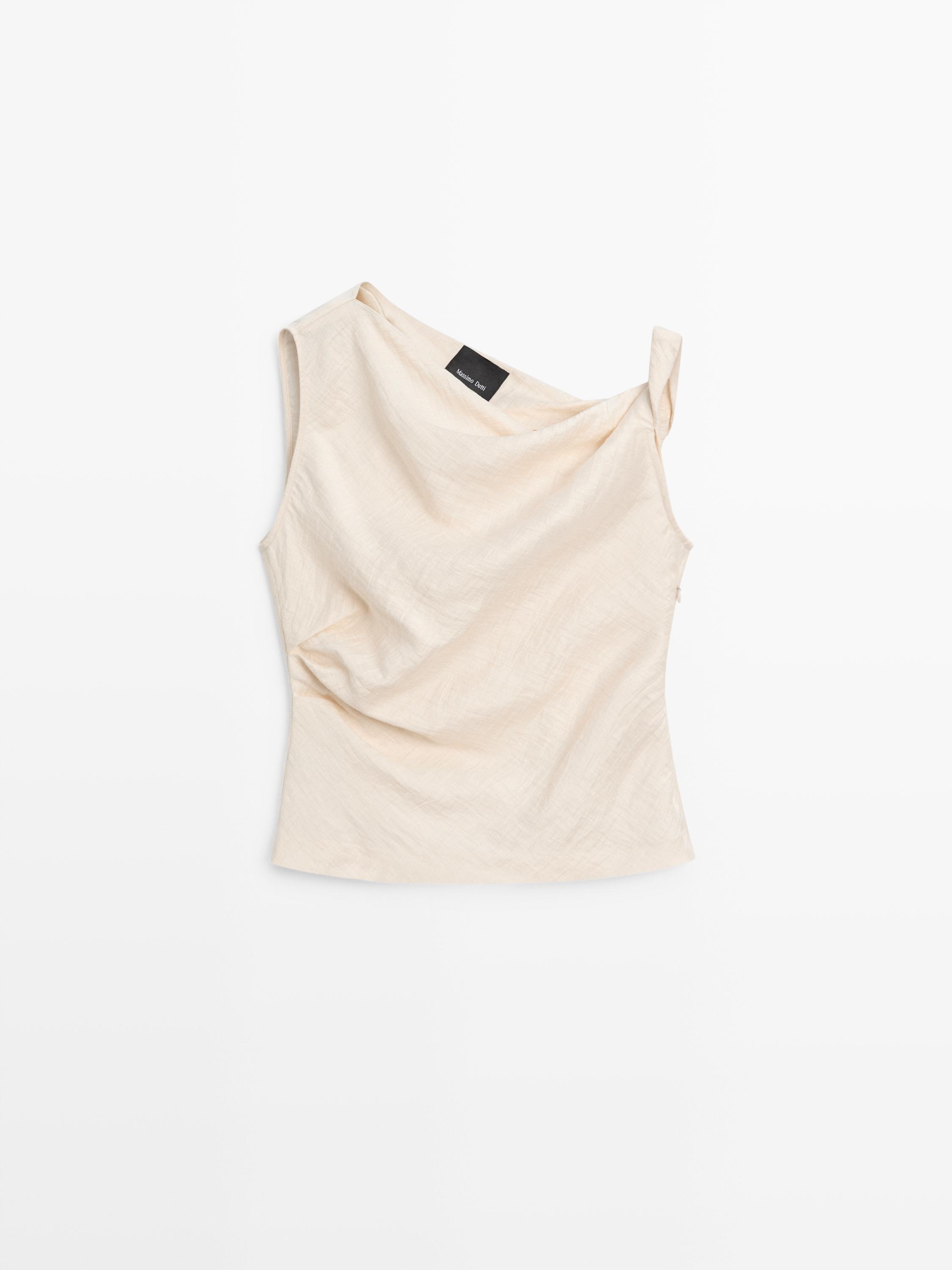 Asymmetric top with knot detail