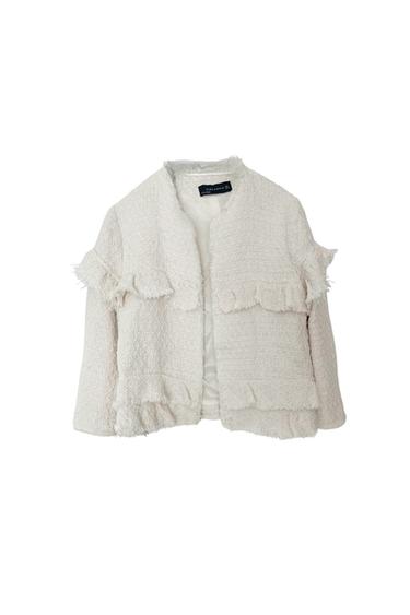 VESTE COURTE À VOLANTS BEIGE.