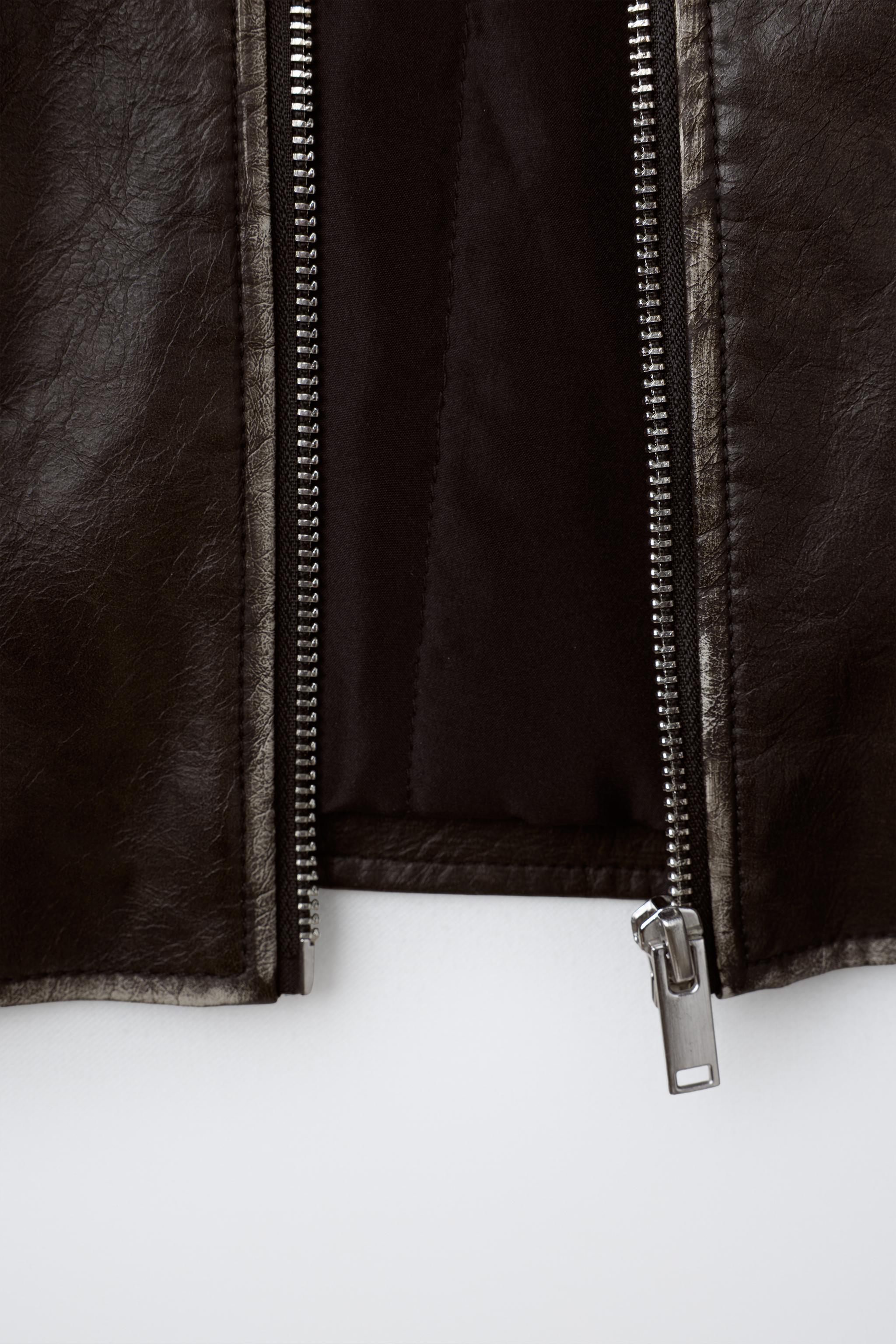 BLOUSON EN MATIÈRE SYNTHÈTIQUE USÉ À COL EFFET FOURRURE
