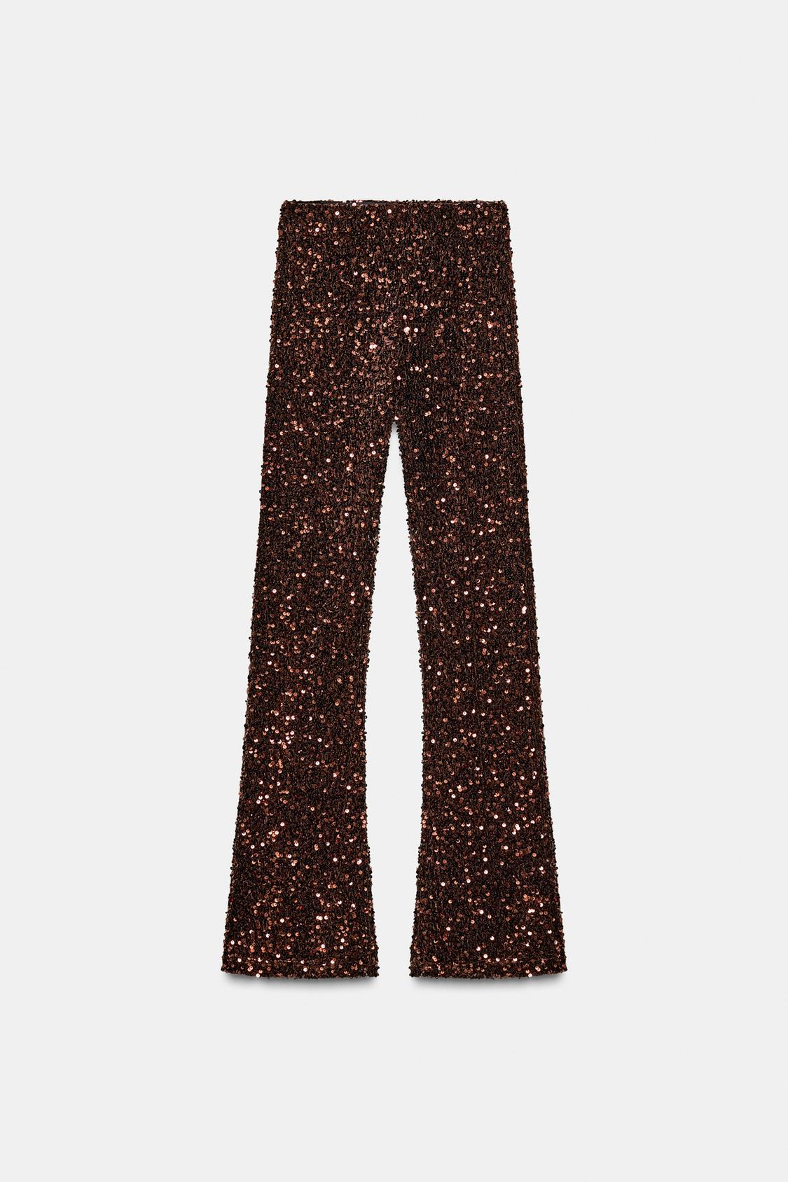 Front view of brown sequin leggings, high-waisted with flared bottoms.
