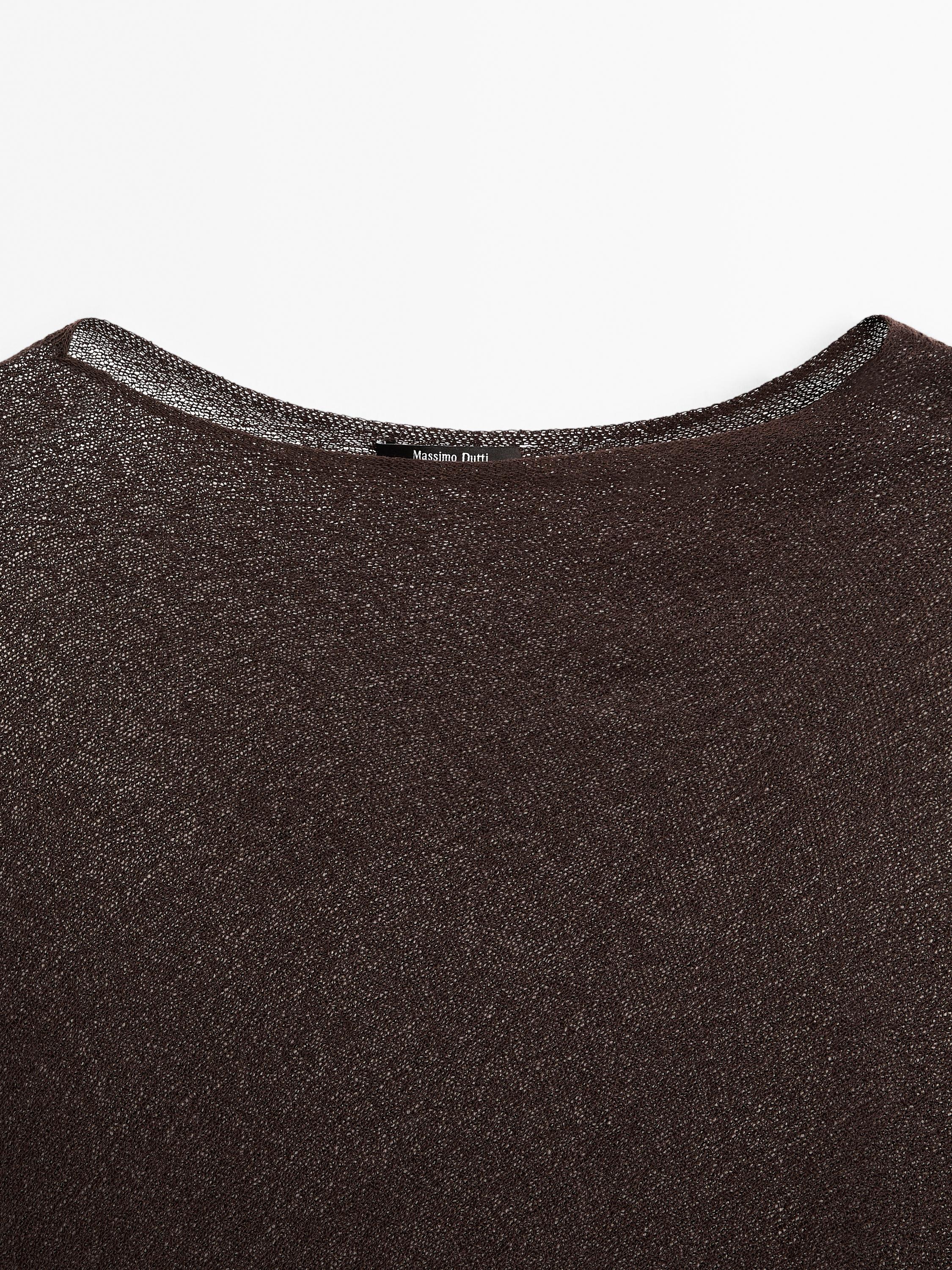 Cape en maille coupe asymétrique