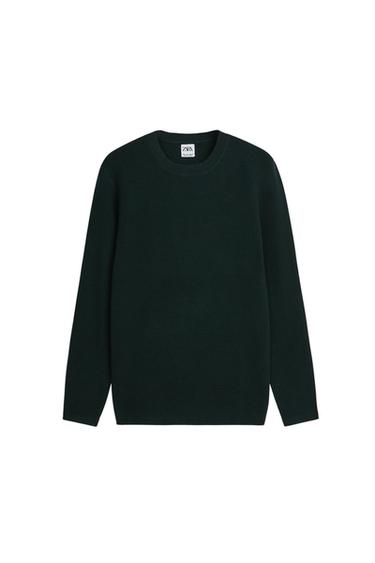 Dark green long-sleeved round neck jumper. Visible label inside the neck with the text "ZARA". White background.