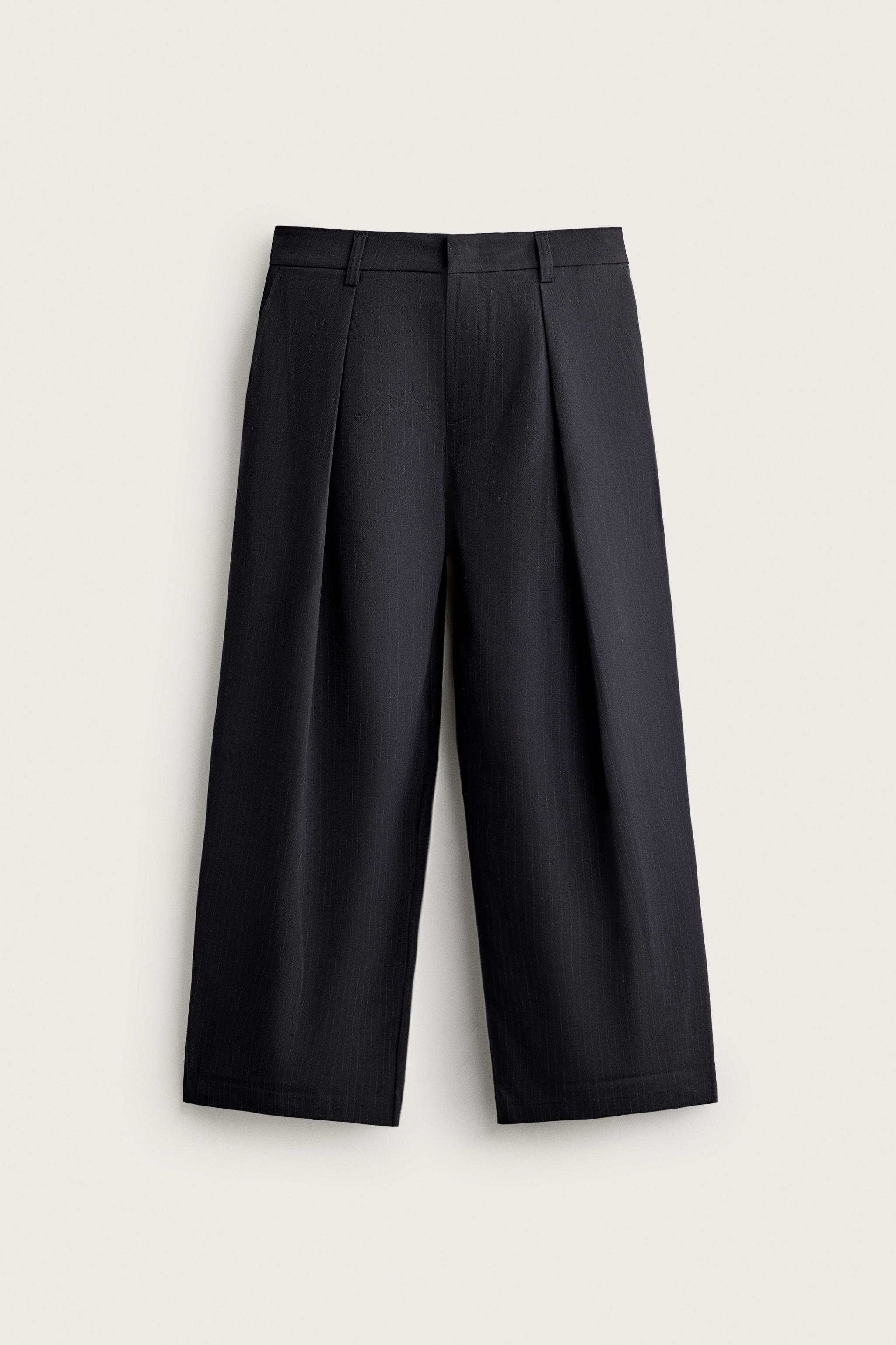 PANTALON COUPE LARGE À PLIS INVERSÉS
