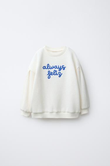 PULOVËR WAFFLE TEKST ME QËNDISJE - E bardhë e thyer nga Zara