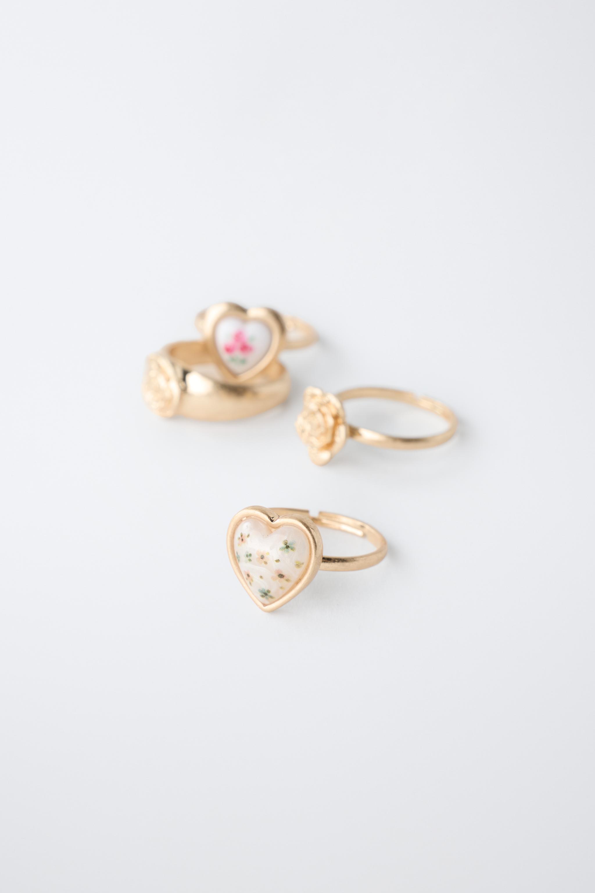 PACK OF FOUR FLOWER AND HEART RINGS — Golden