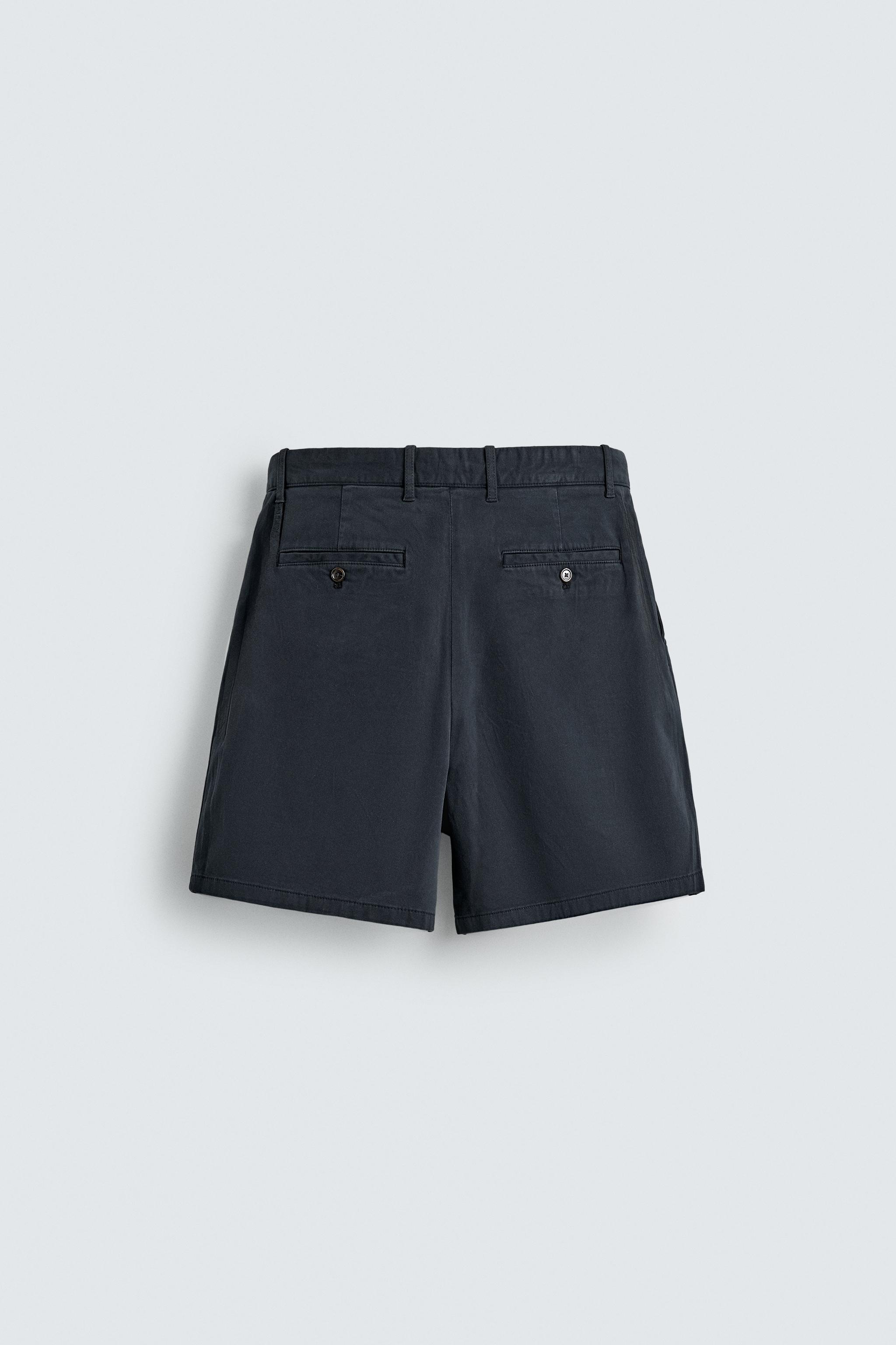 REGULAR FIT PLEATED CHINO SHORTS