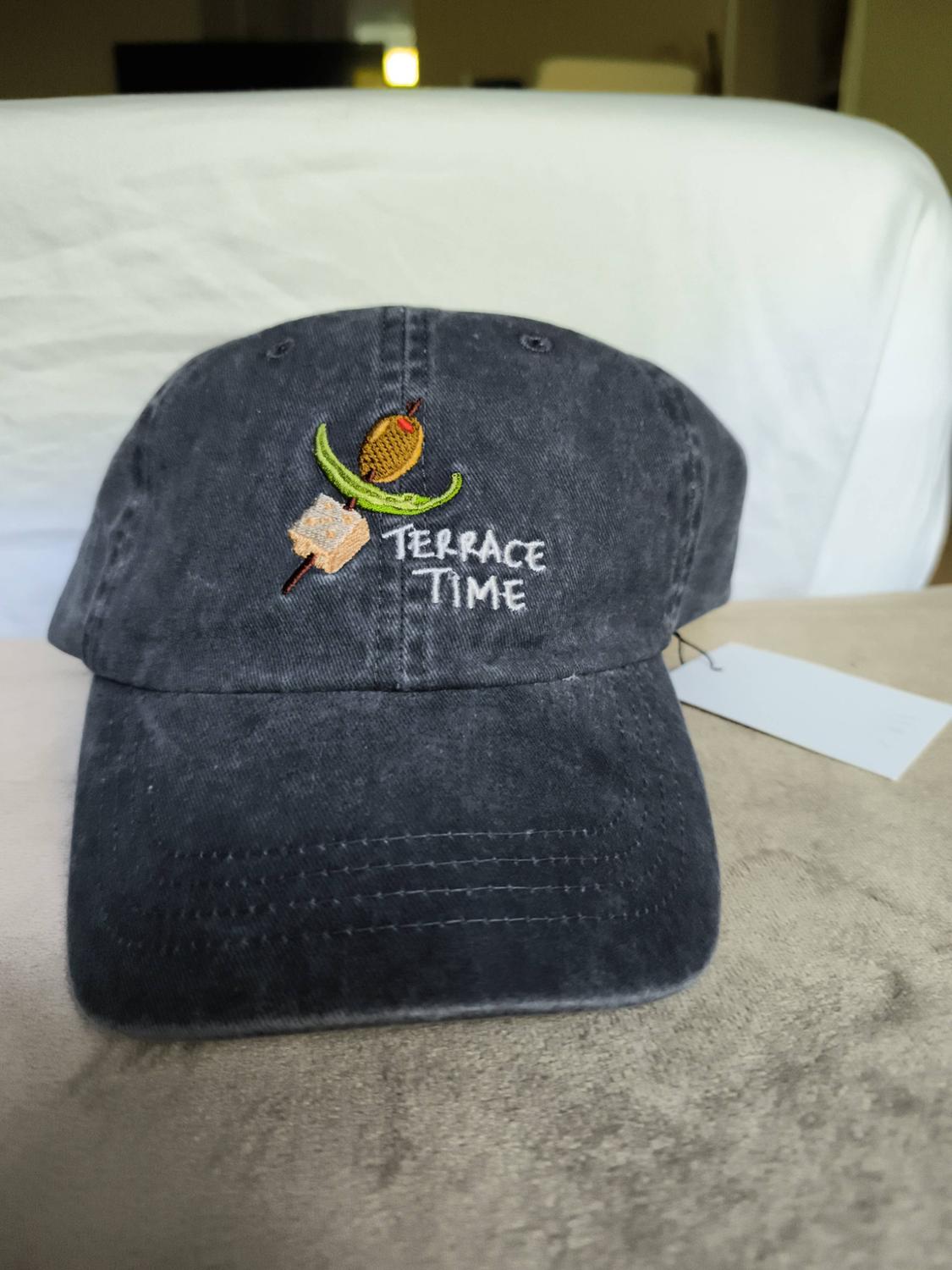 Dark grey cap with a washed effect on a light background. It features an embroidered spike and the text TERRACE TIME in white.
