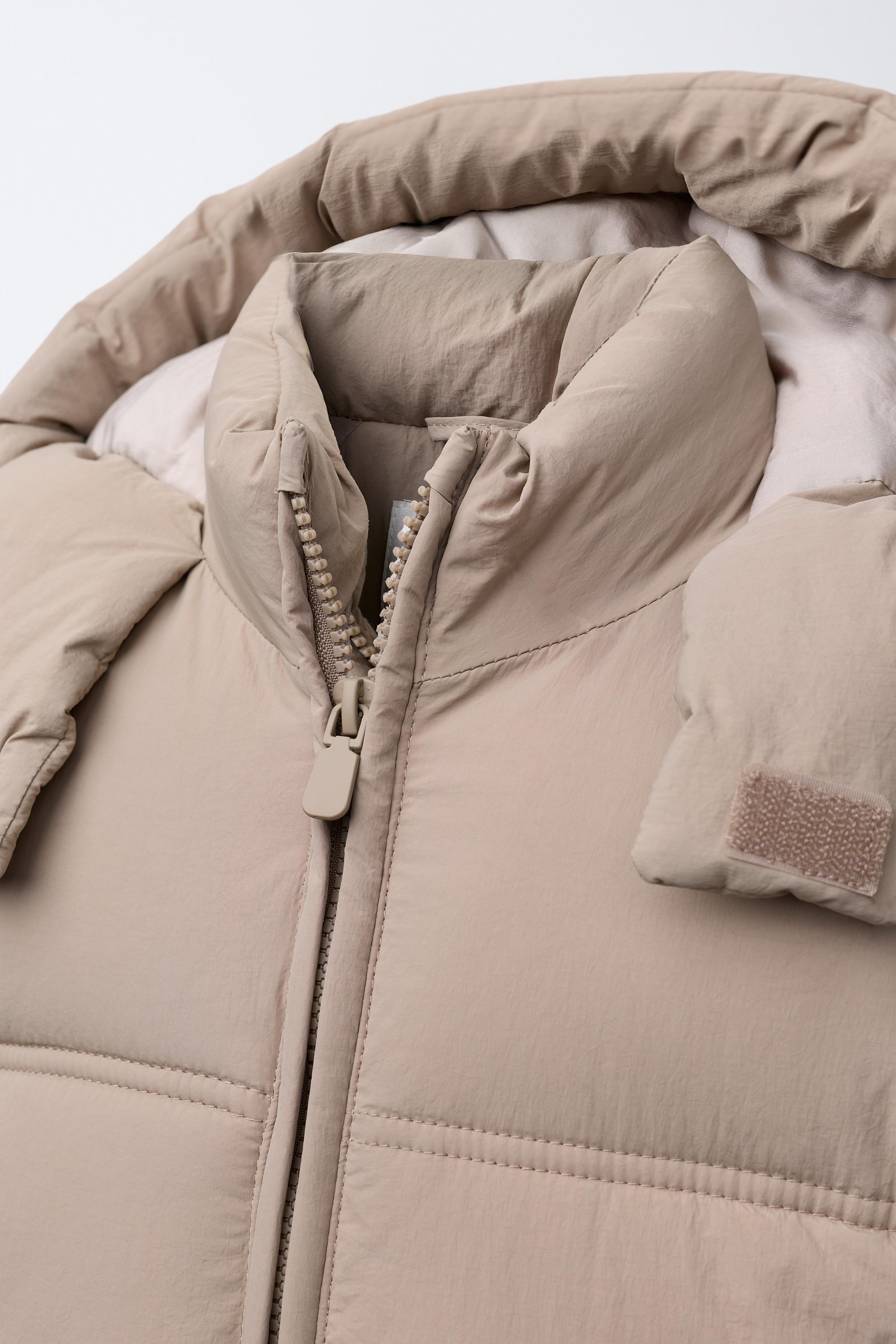 MANTEAU MATELASSÉ À CAPUCHE DÉPERLANT