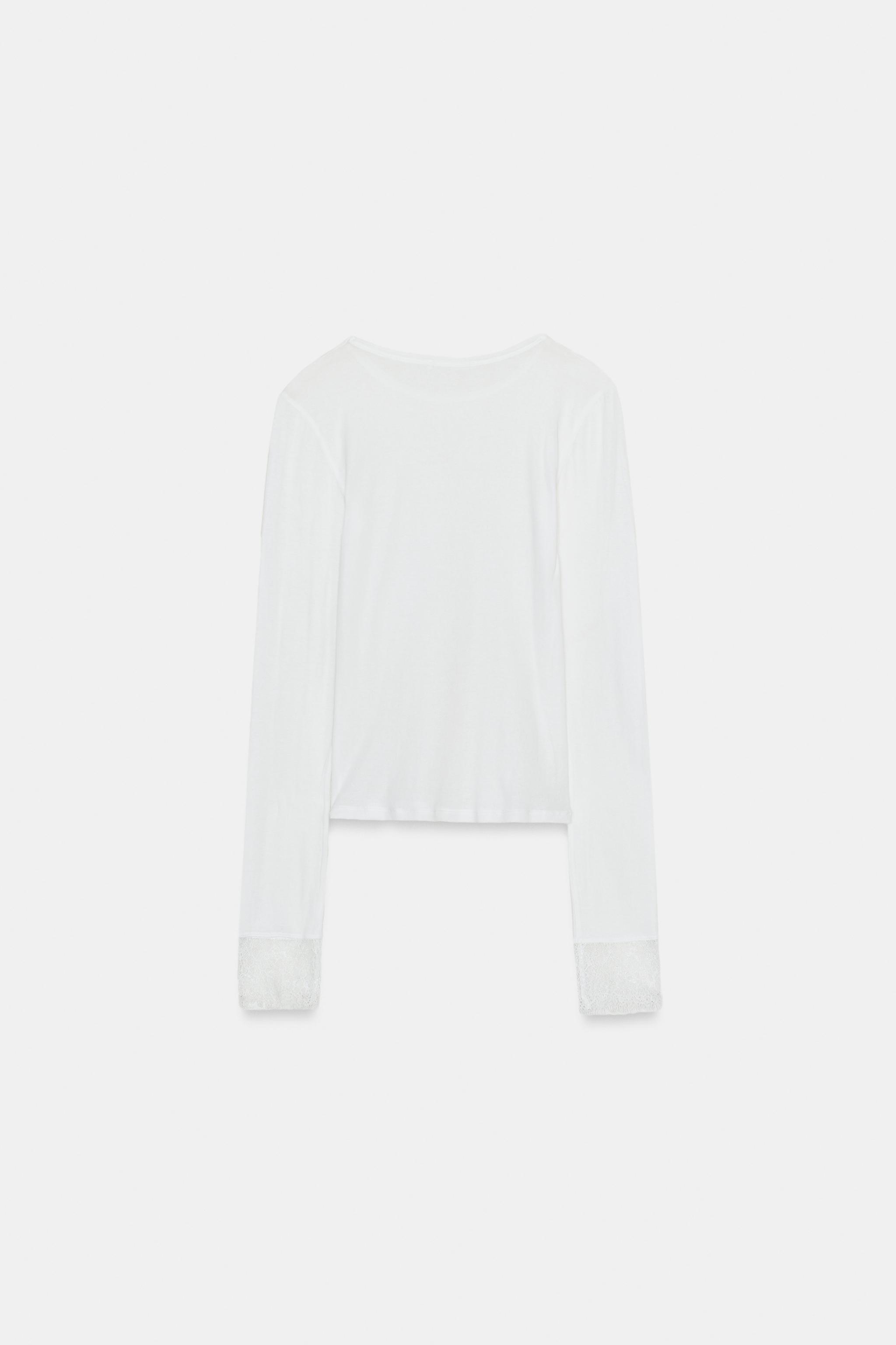 TOP SEMI-TRANSPARENT AVEC POIGNETS EN DENTELLE