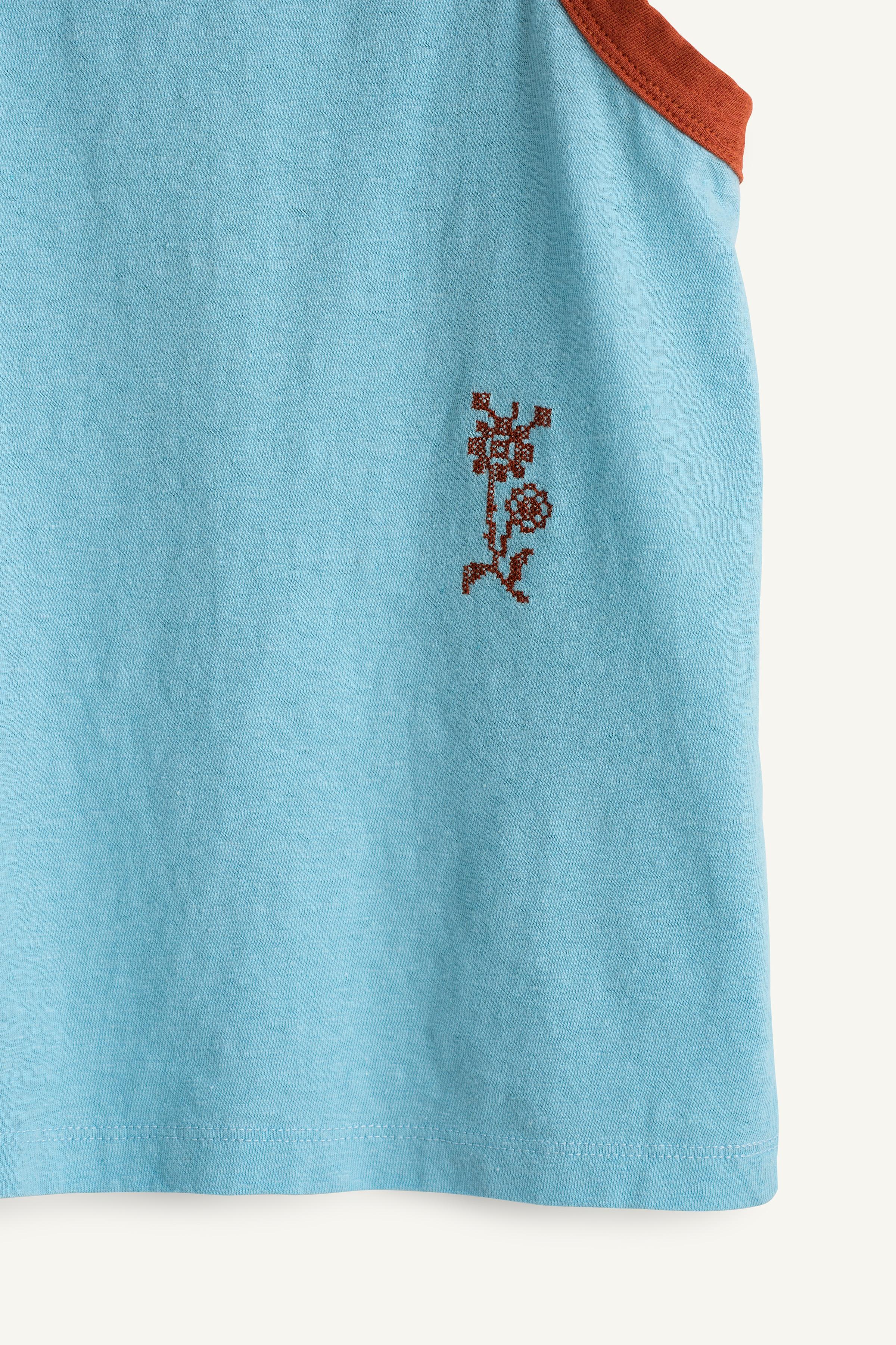 CHEMISE SANS MANCHES FLEUR BRODÉE ÉDITION LIMITÉE