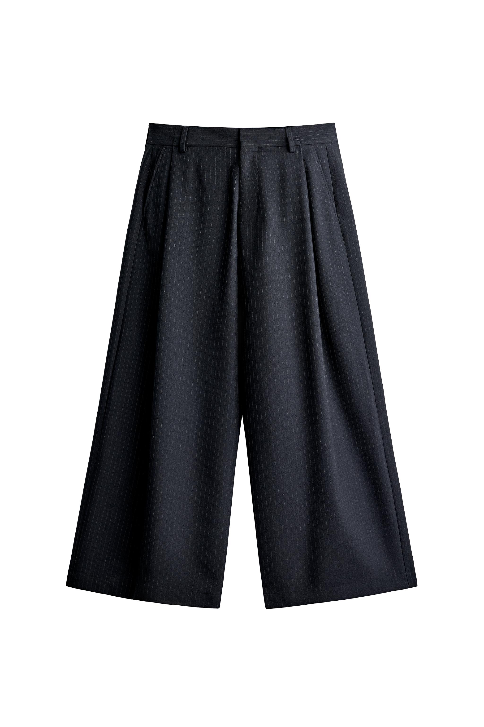 PANTALONS DE CAMA AMPLA AMB PLECS