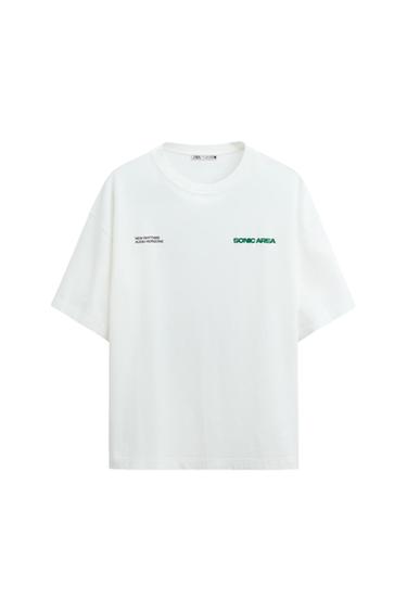 Front view of a white t-shirt with 'NEW RHYTHMS AUDIO HORIZONS' and 'SONIC AREA' printed on the chest.