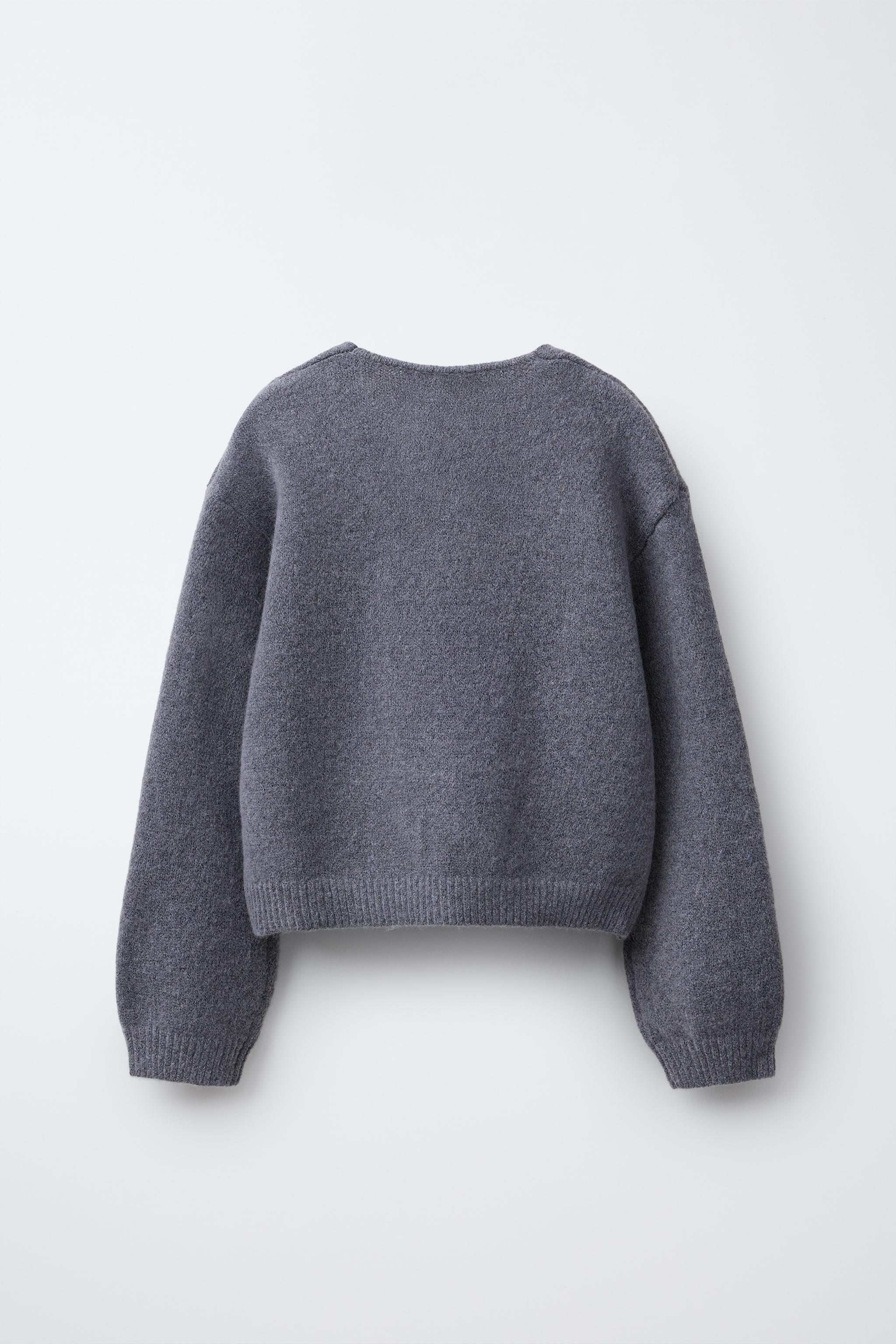 GILET EN MAILLE COL V NŒUDS BRILLANTS