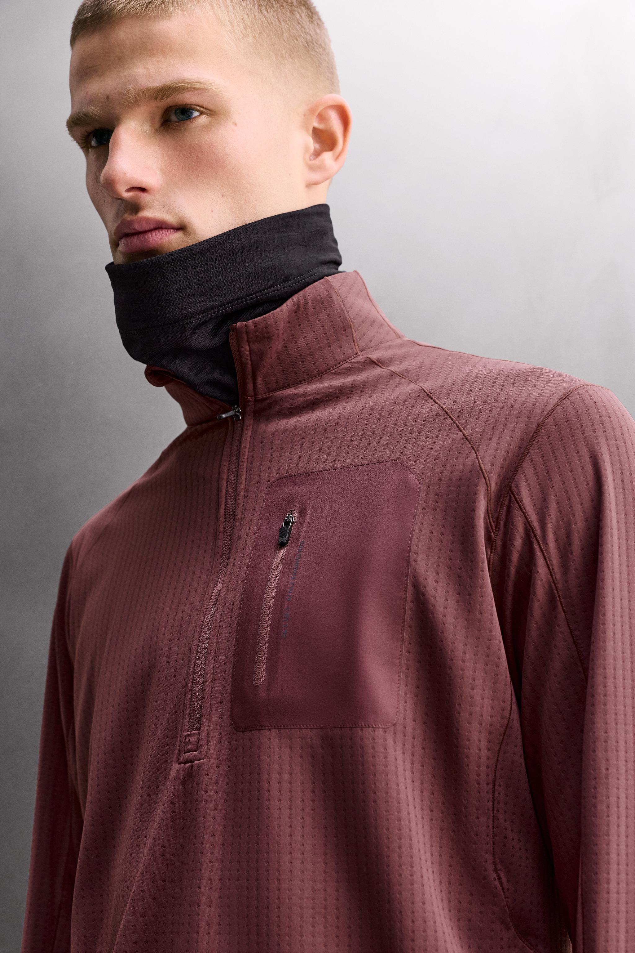 COMBINATION POCKET QUARTER-ZIP SWEATSHIRT