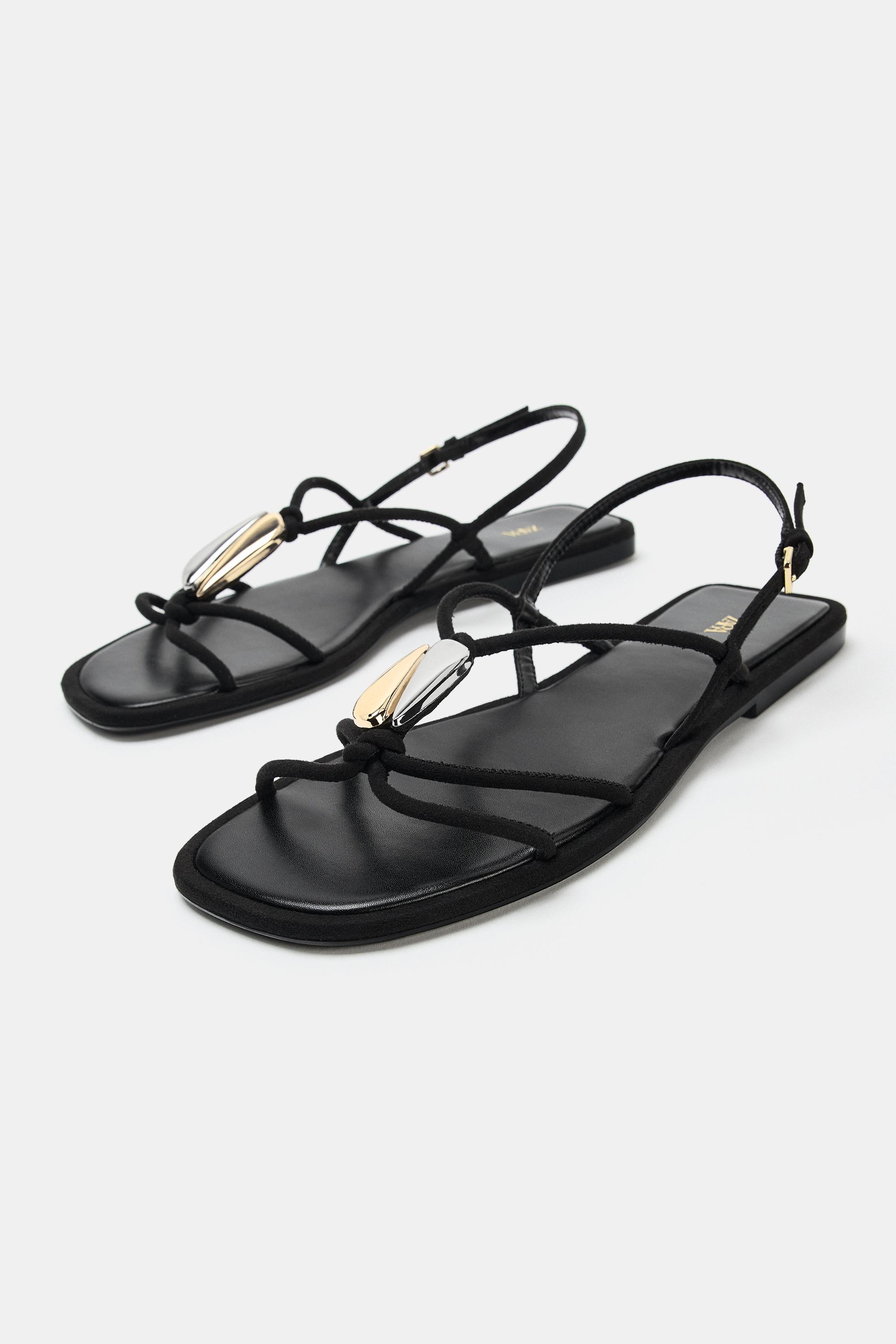 FLAT SANDALS WITH METALLIC APPLIQUÉ
