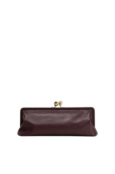 Rectangular handbag in burgundy with a gold metal zipper on top, on a white background.