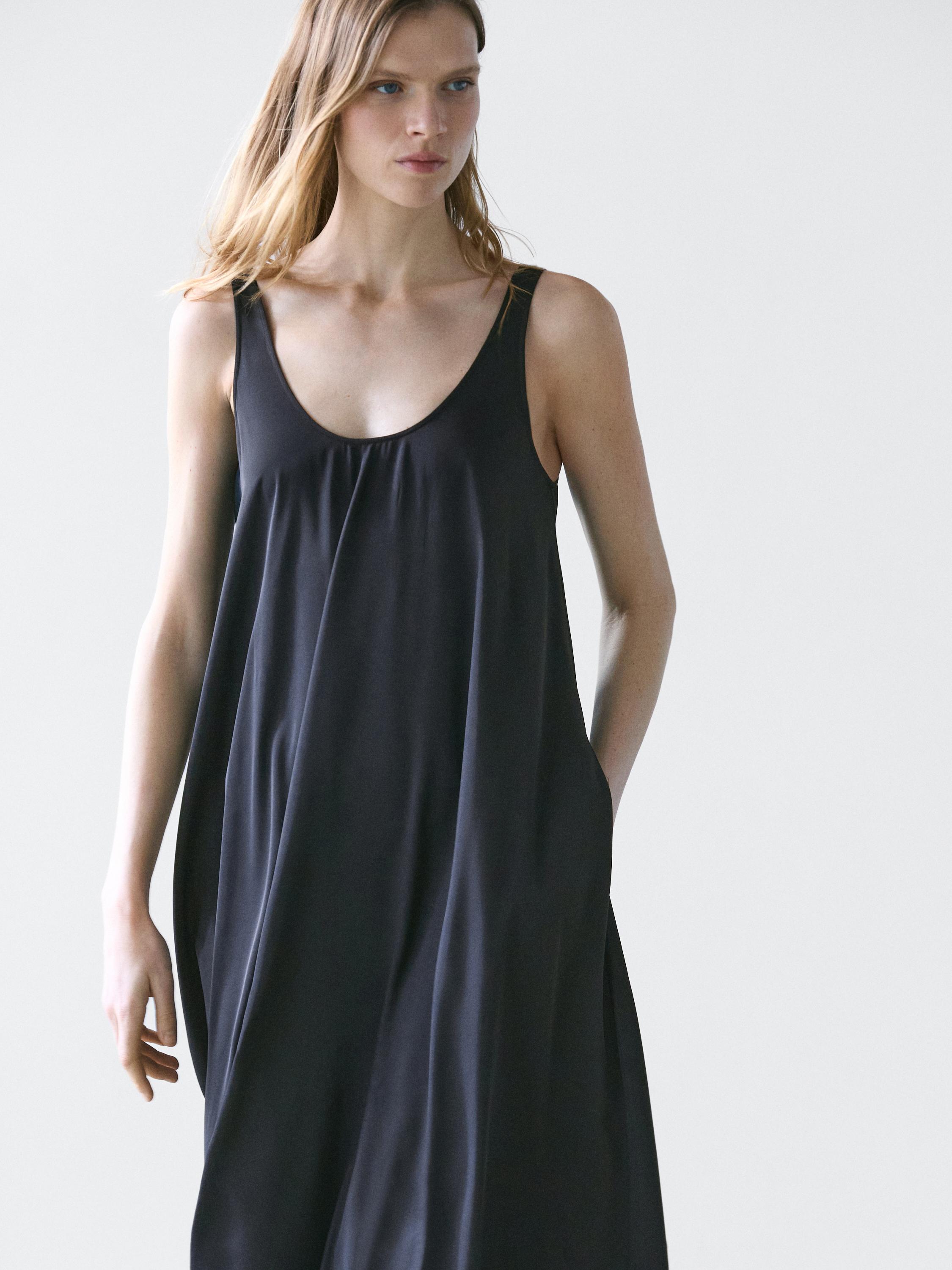 Flowing flared dress with straps