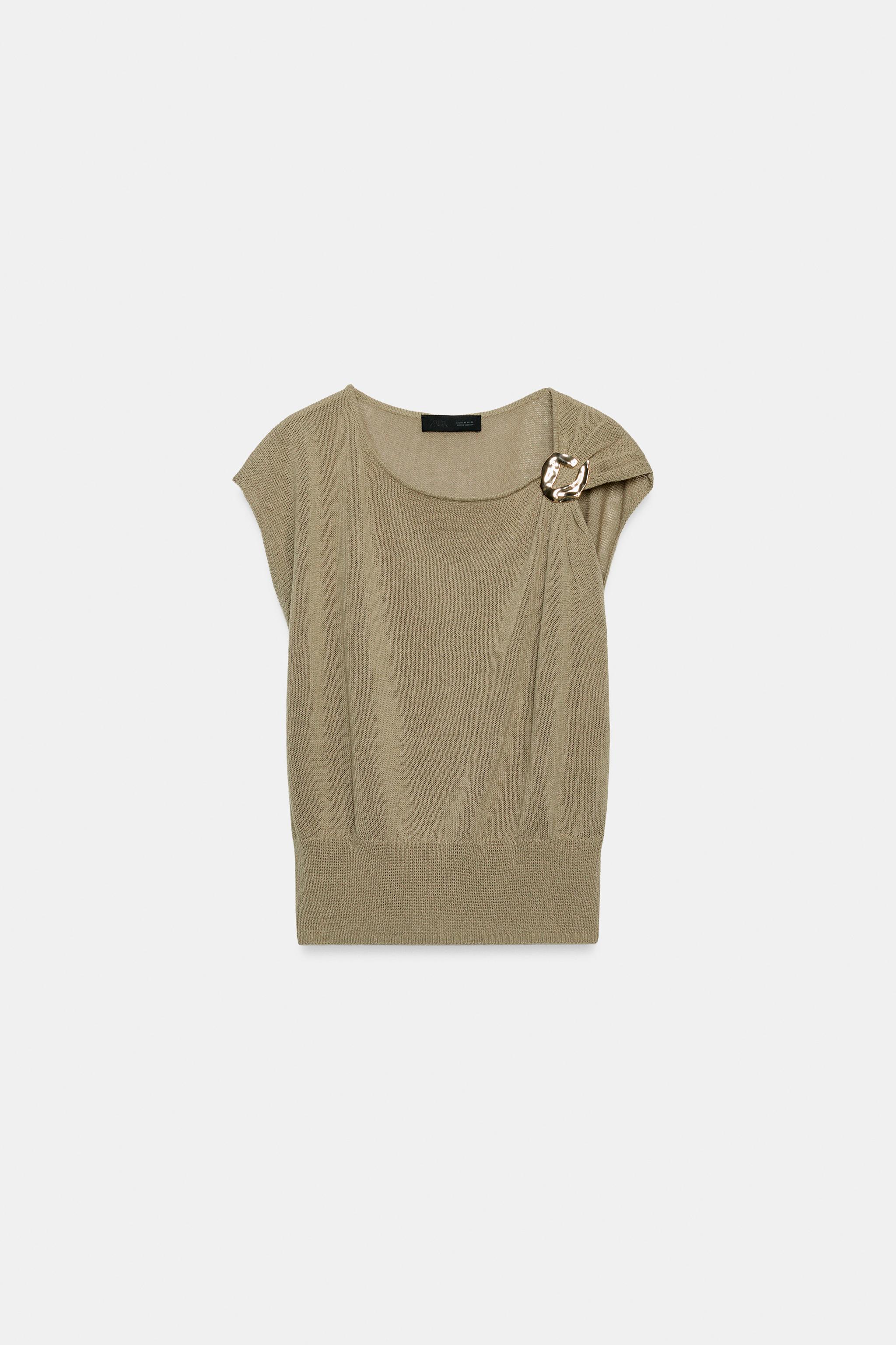 TOP EN MAILLE À FINITIONS