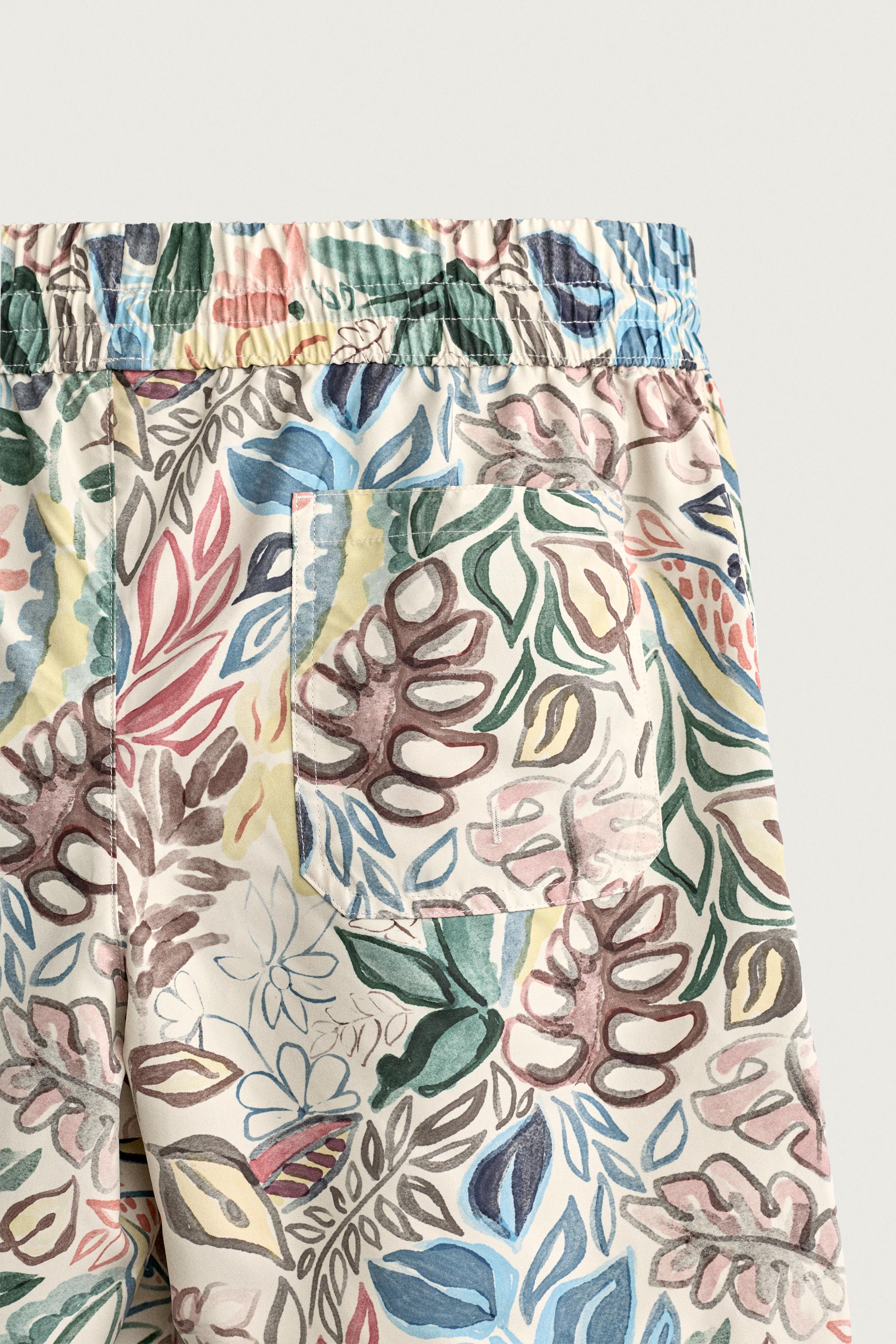 LONG FLORAL PRINT SWIM TRUNKS