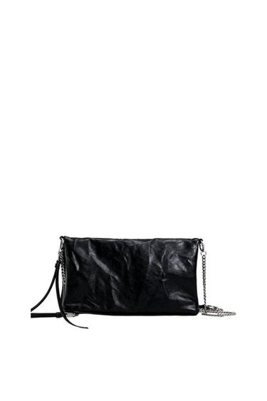 Front view of a black purse with a chain and metallic details.