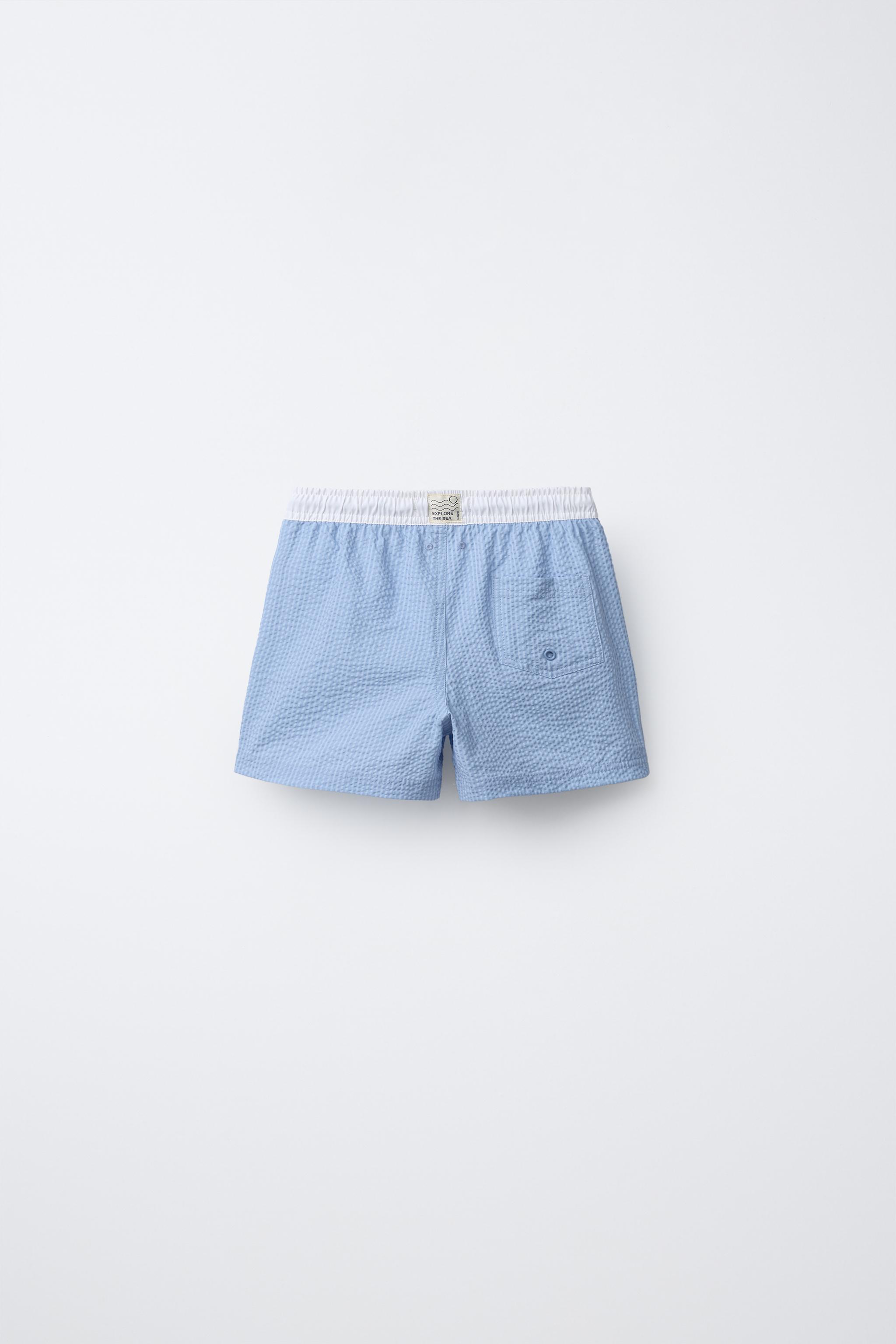 AGES 6-14 / LABEL SWIM SHORTS