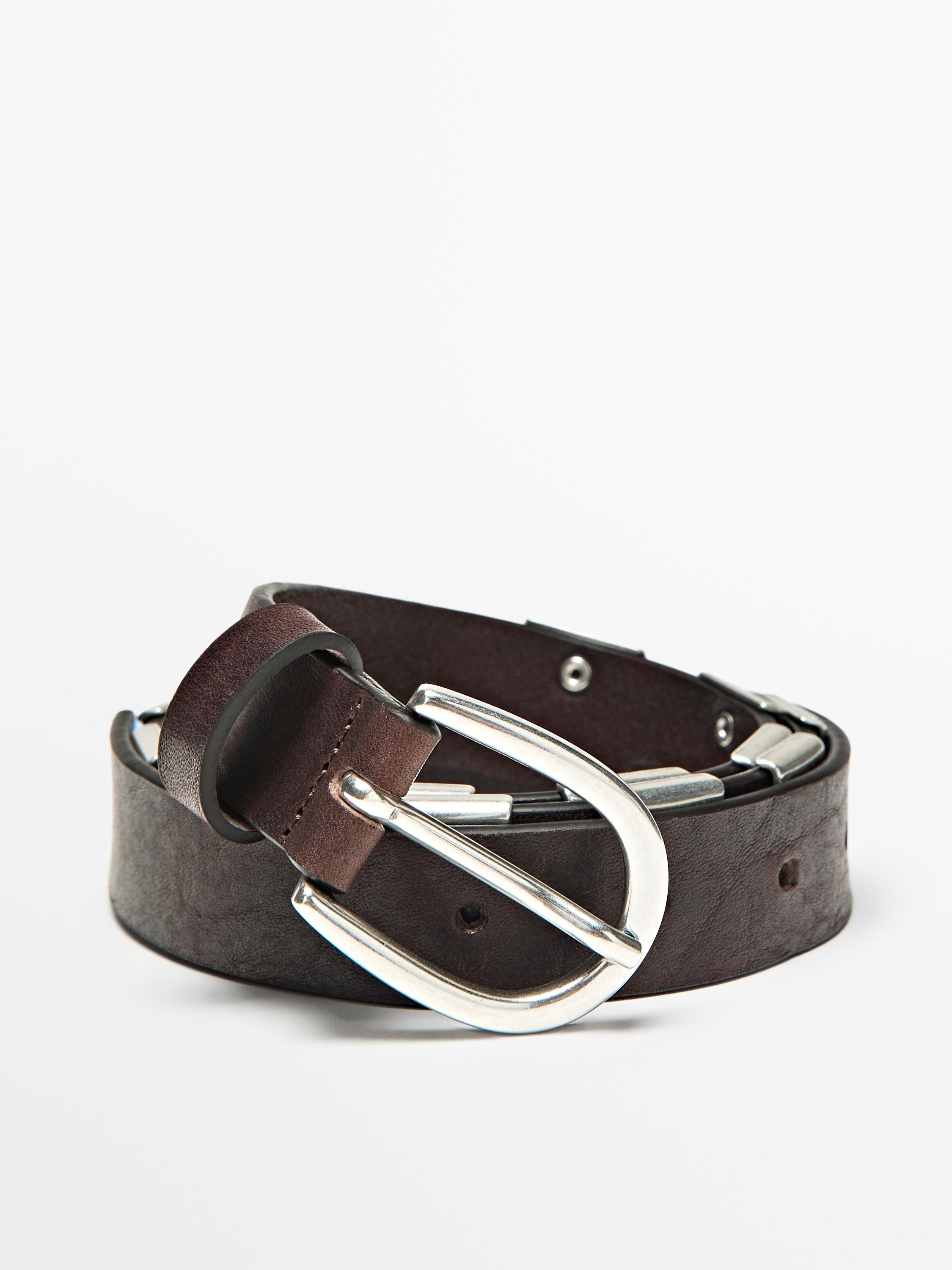 Belt with metal appliqués