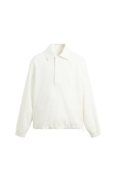 Front view of a white jacket with a classic collar and side pockets.