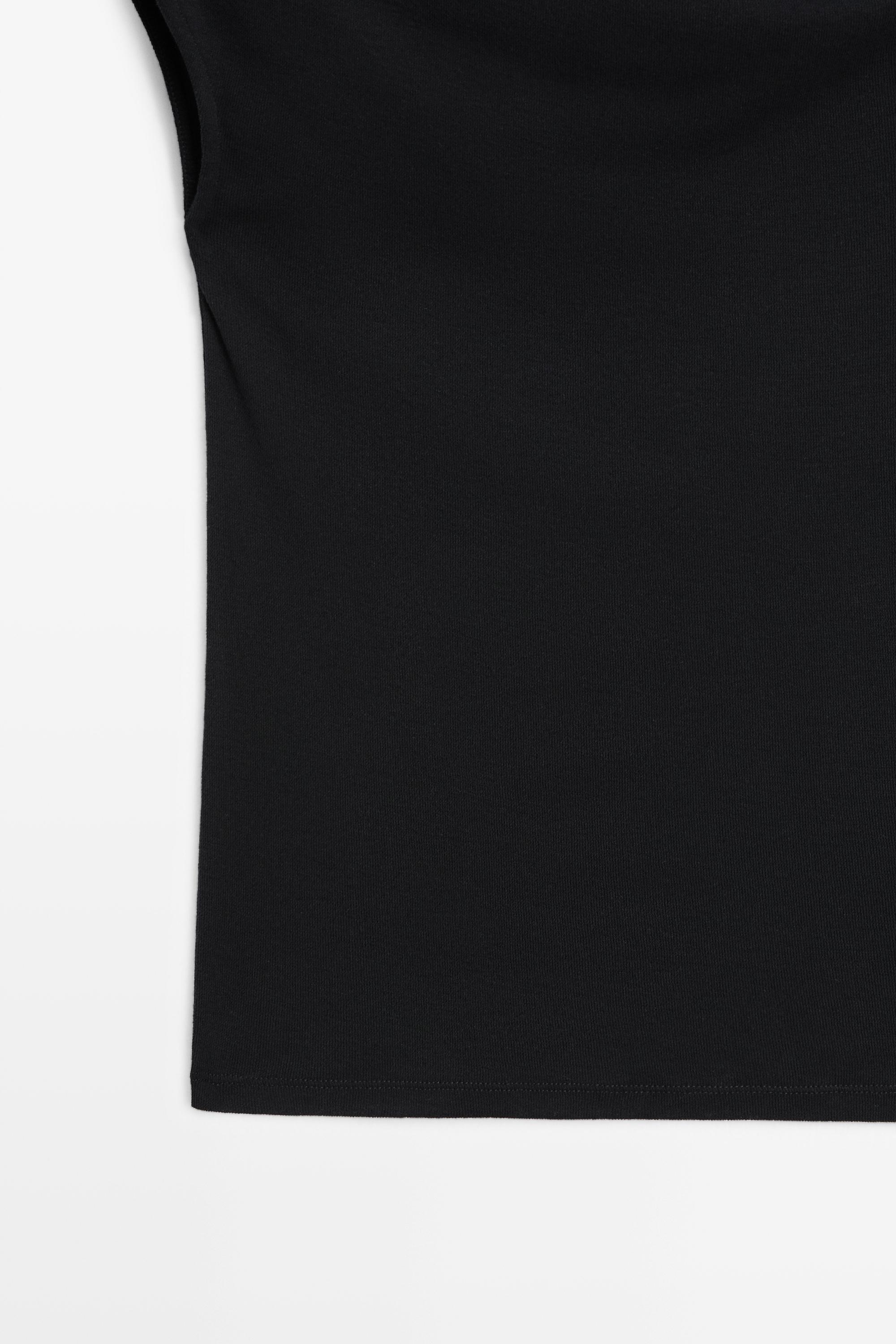 Top asymétrique détail bijou