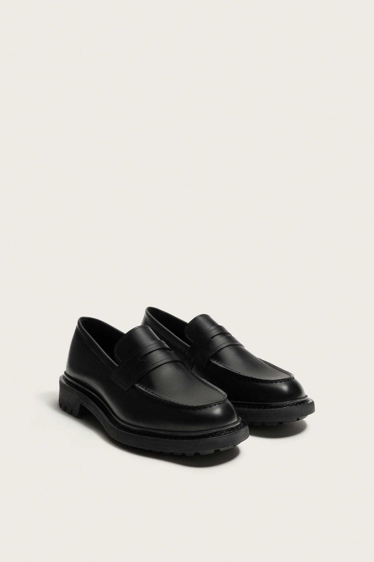 LEATHER LUG-SOLE PENNY LOAFERS — Black