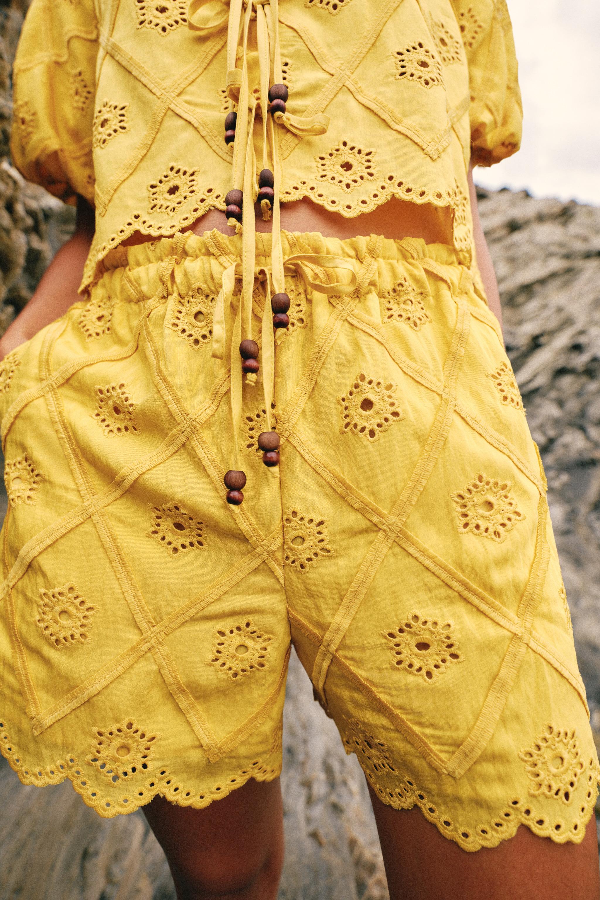 EMBROIDERED EYELET TOP