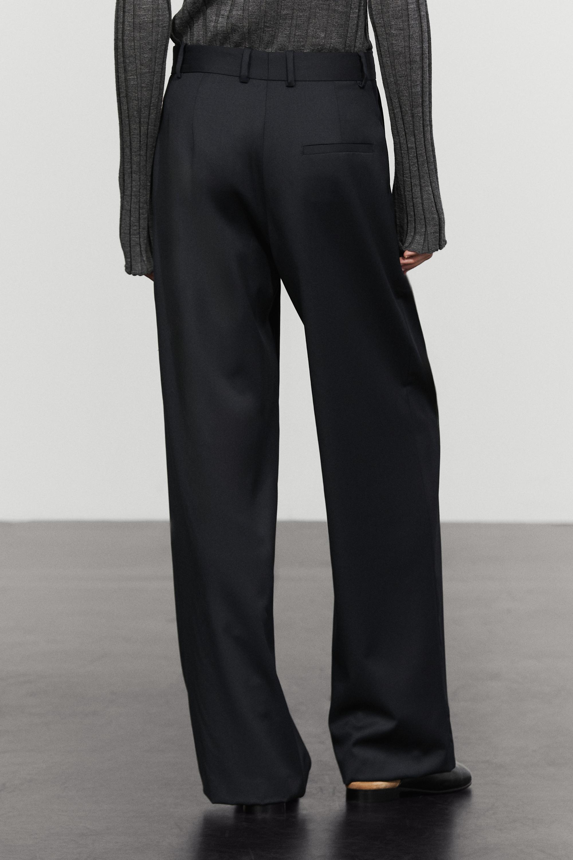 Pleated extra fine wool trousers