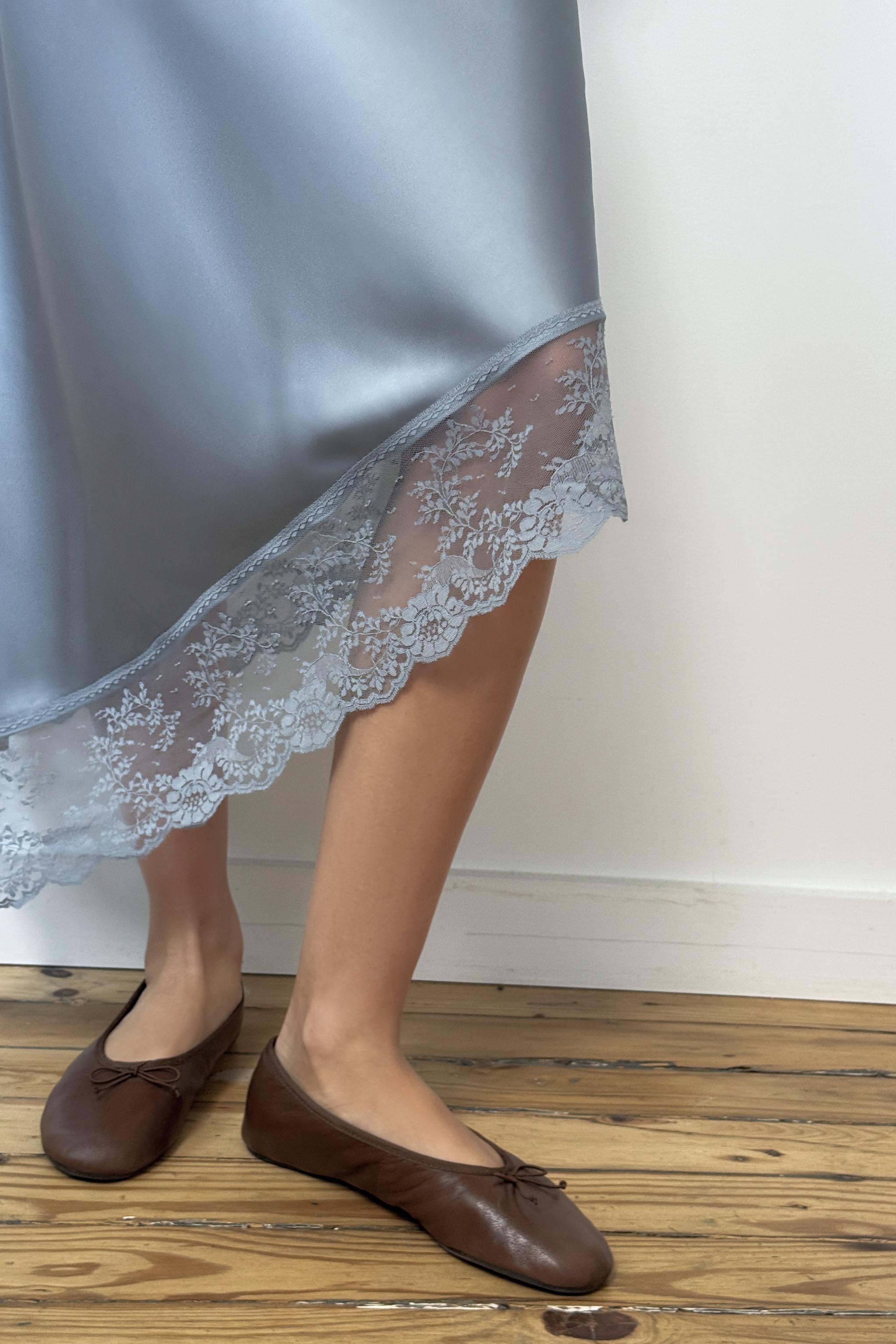 SATIN EFFECT MIDI SKIRT WITH ASYMMETRIC HEM AND LACE