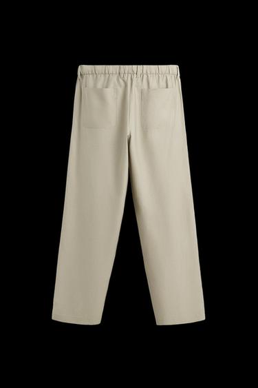 PANTALÓN FLUIDO RELAXED FIT - Oliva de Zara