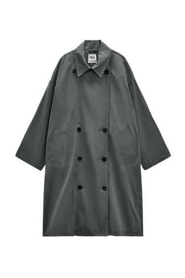 Dark grey double-breasted coat with side pockets and a classic collar. Visible "ZARA" label.