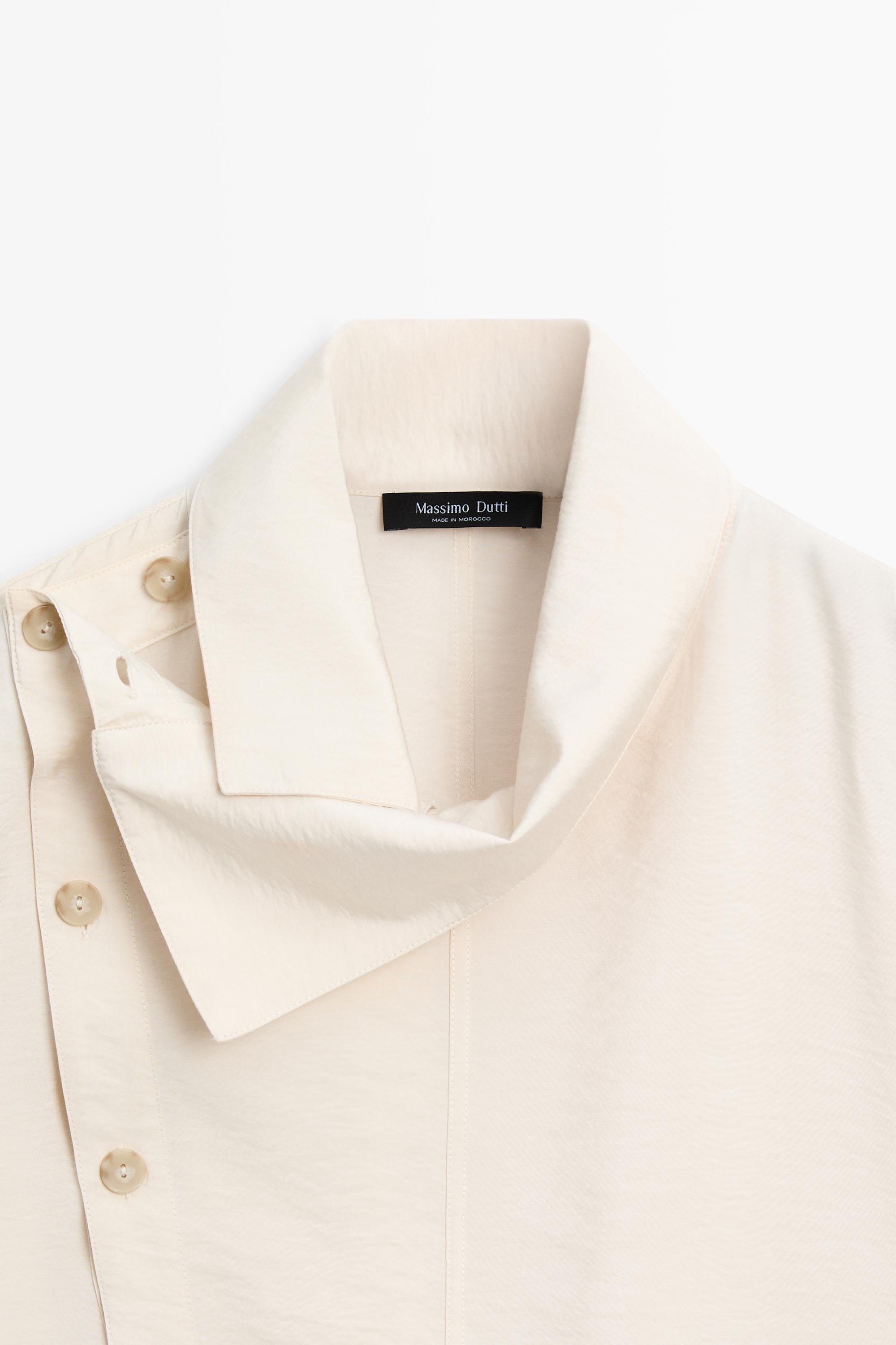 Flowing shirt with asymmetric buttons
