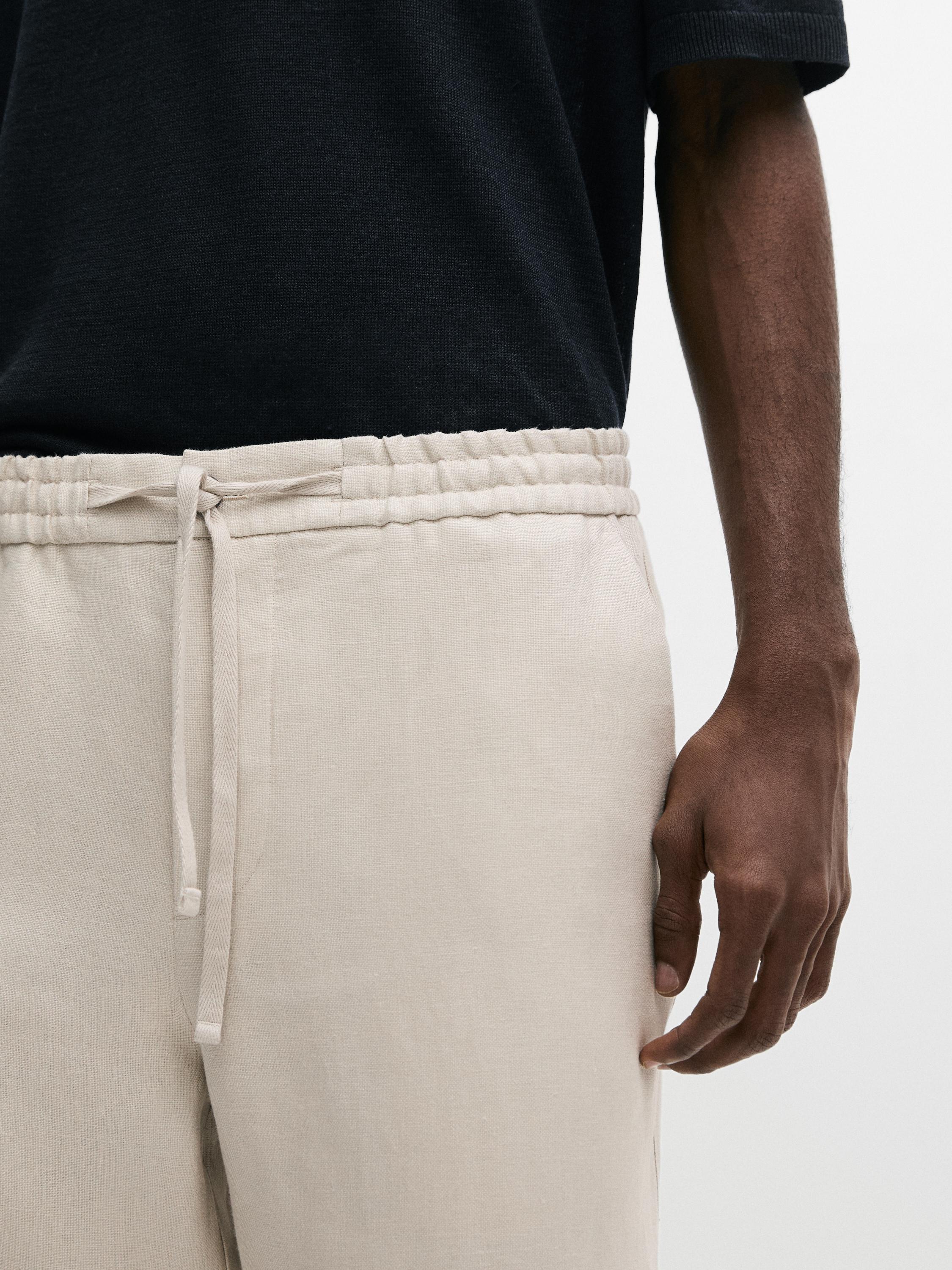 Total look linen trousers with waist detail