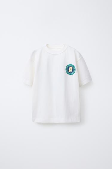 Zara MAJICA SA PRINCE ® PRINTOM – Bela