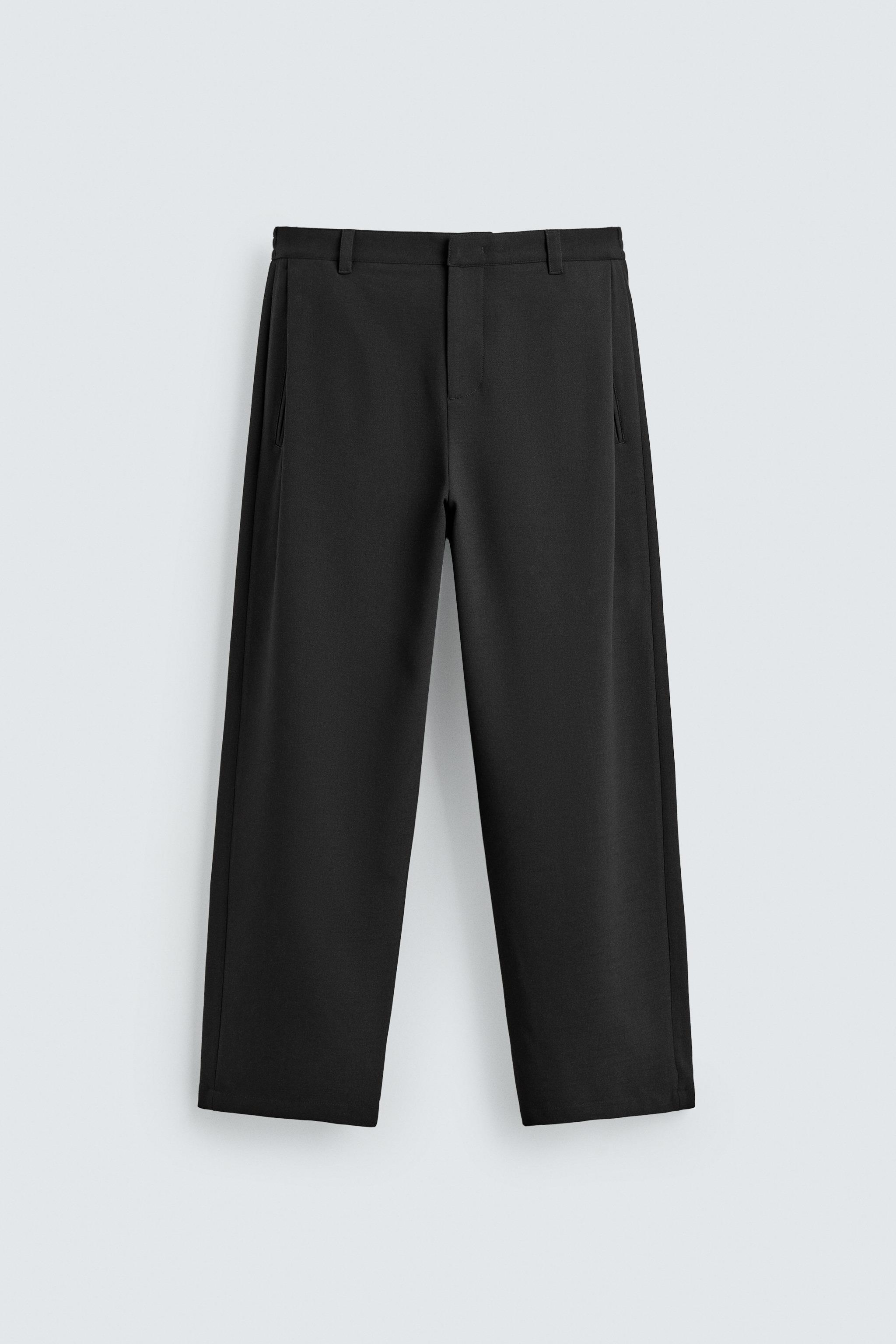 RELAXED FIT PLEATED PANTS