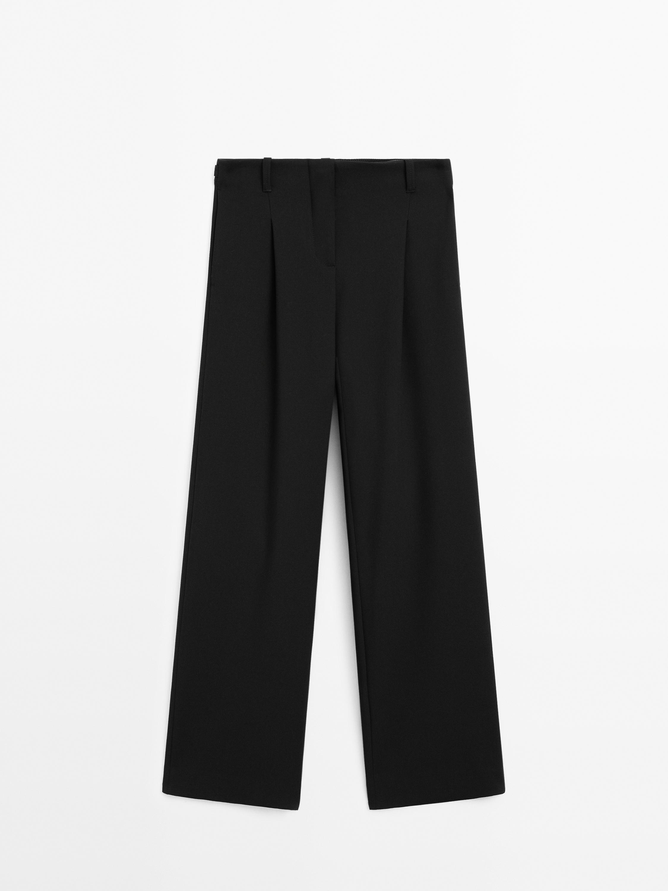 Pantalon taille moyenne fluide avec boucles