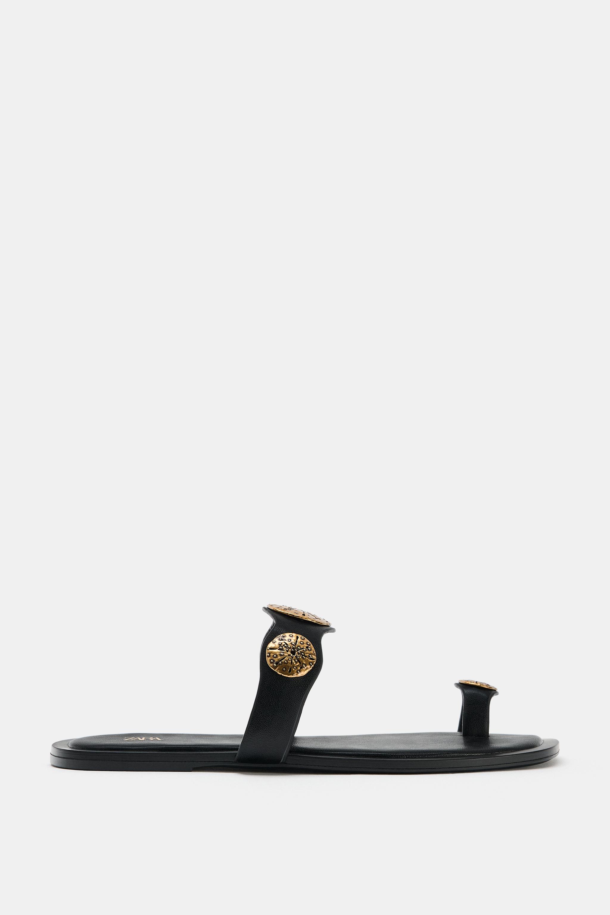 FLAT SANDALS WITH METALLIC DETAILS