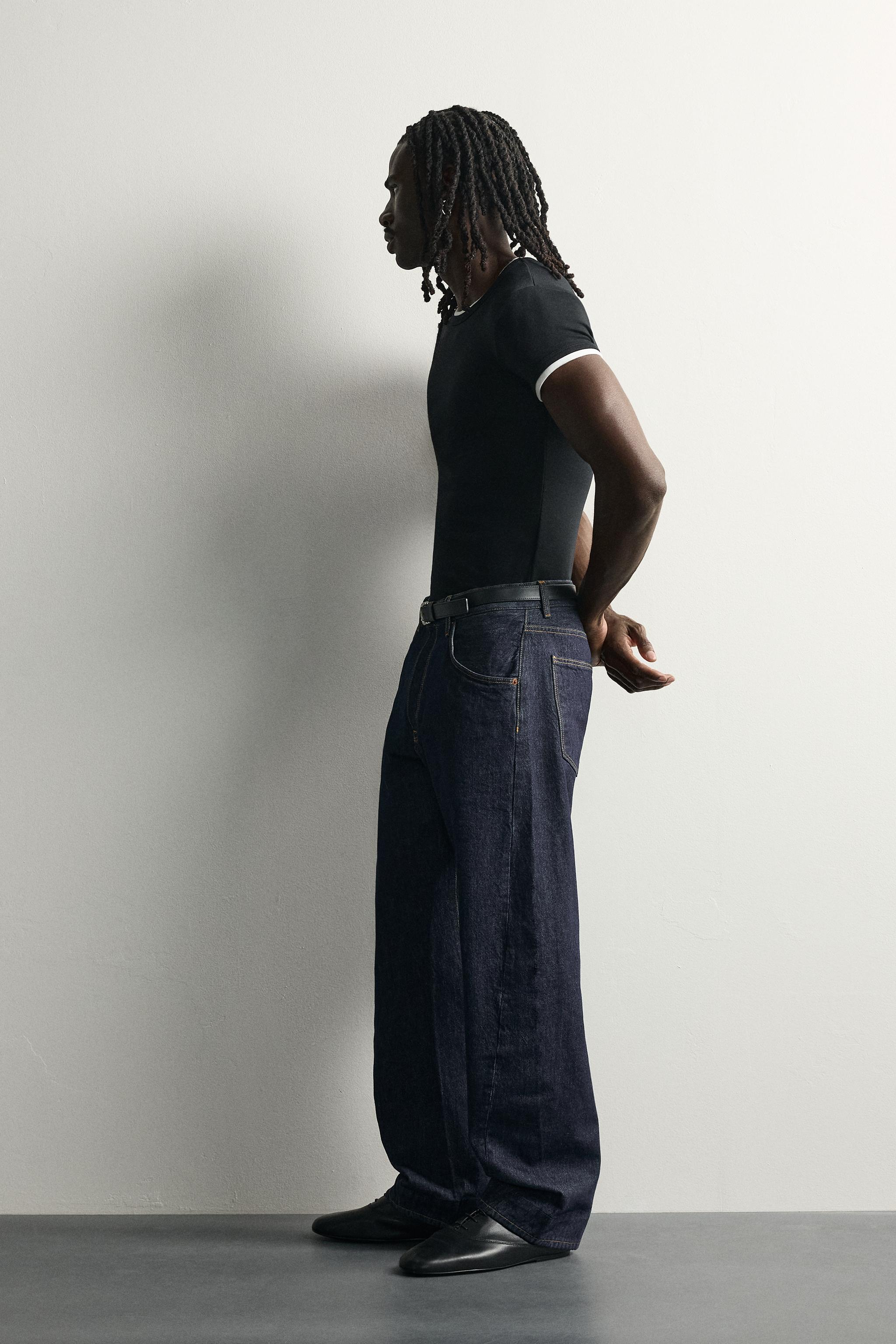 STRAIGHT-FIT JEANS WITH TWISTED SEAMS