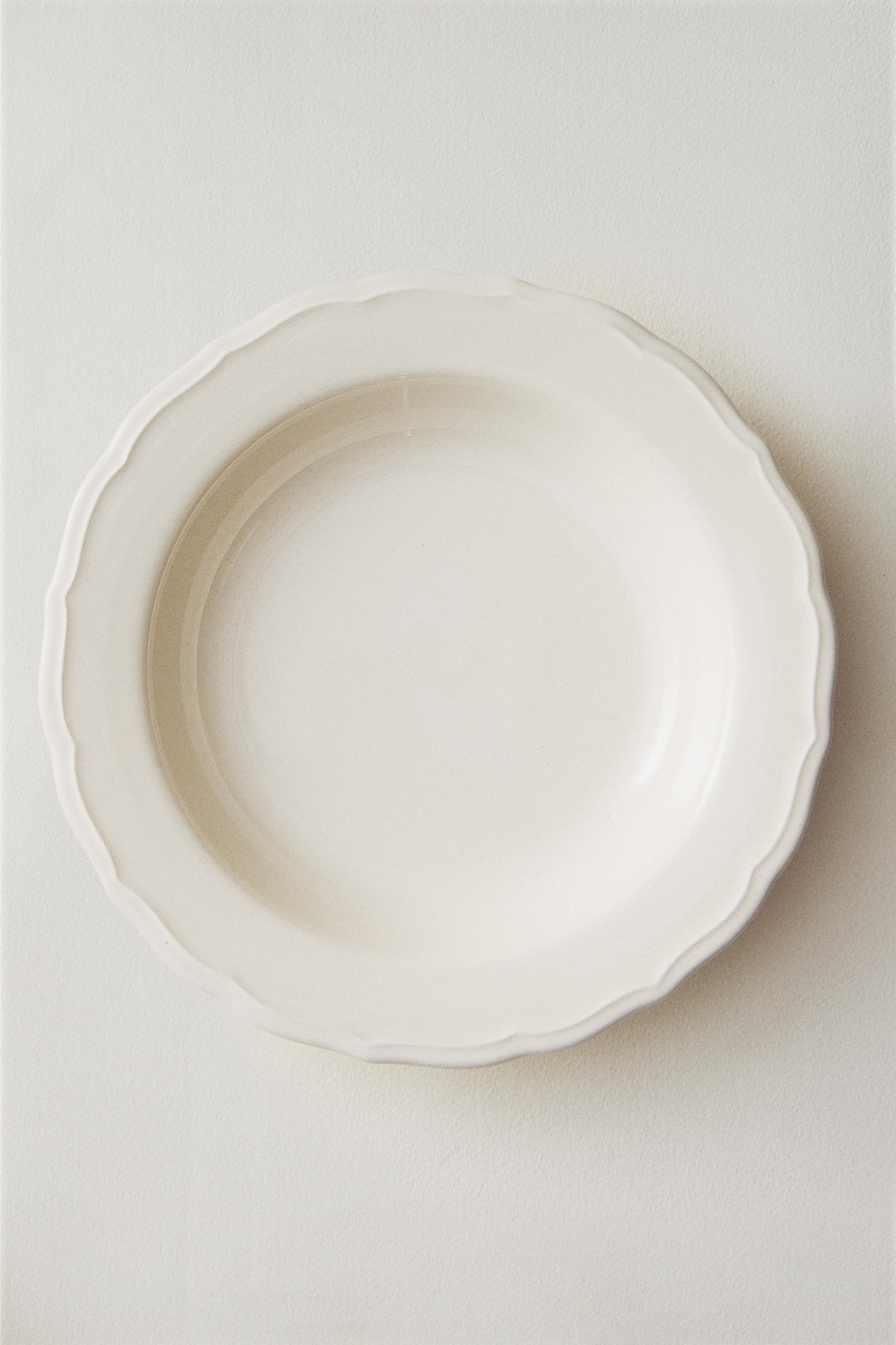 EARTHENWARE SOUP PLATE WITH RAISED-DESIGN EDGE