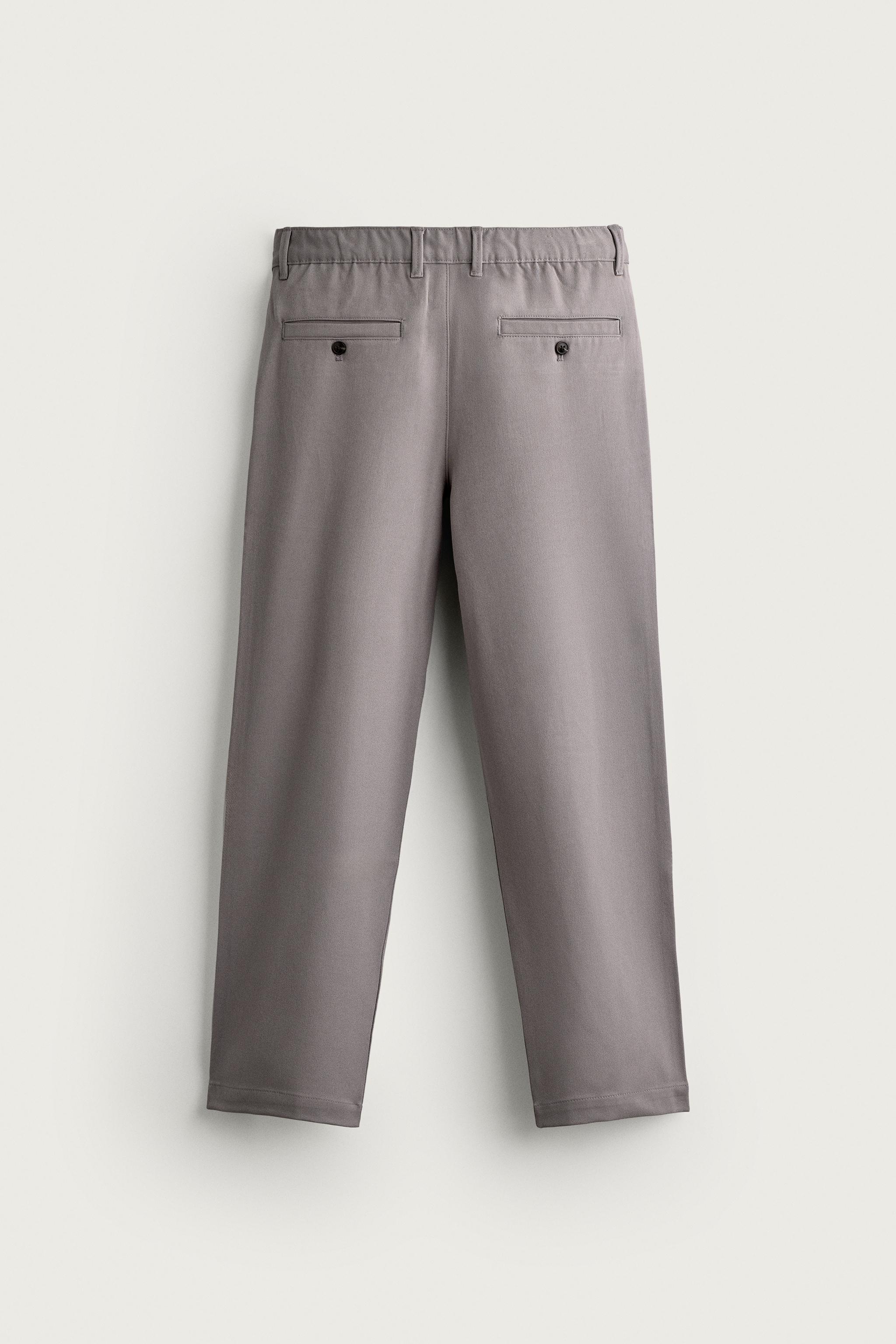 RELAXED FIT PLEATED PANTS
