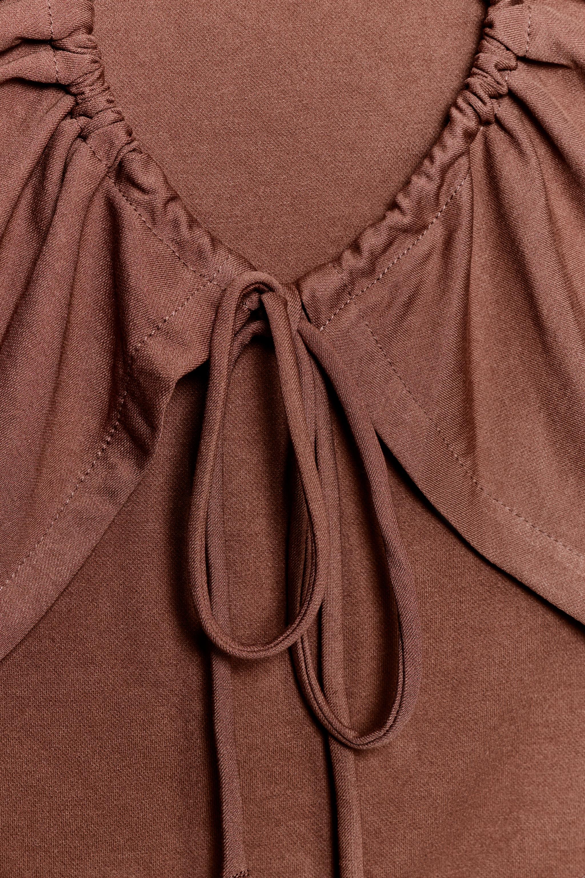 FLOWY TOP WITH BACK OPENING