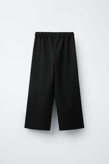 PANTALON À JAMBES LARGES AVEC CLOUS - Noir de Zara - Image 1