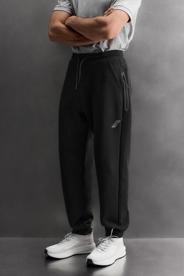 TECHNICAL TROUSERS WITH ZIP - Black by Zara